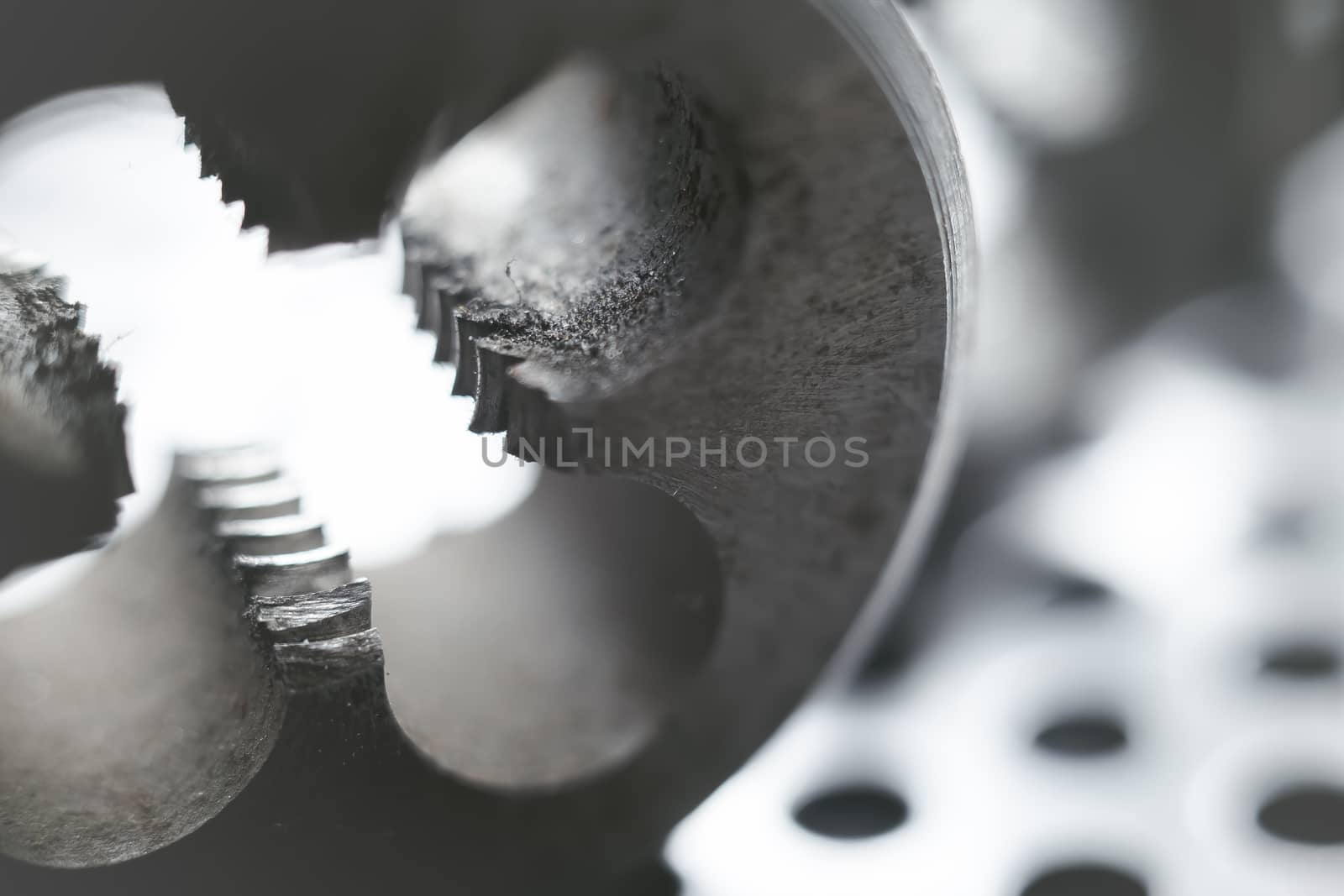 Thread cutting die at factory workshop. Selective focus