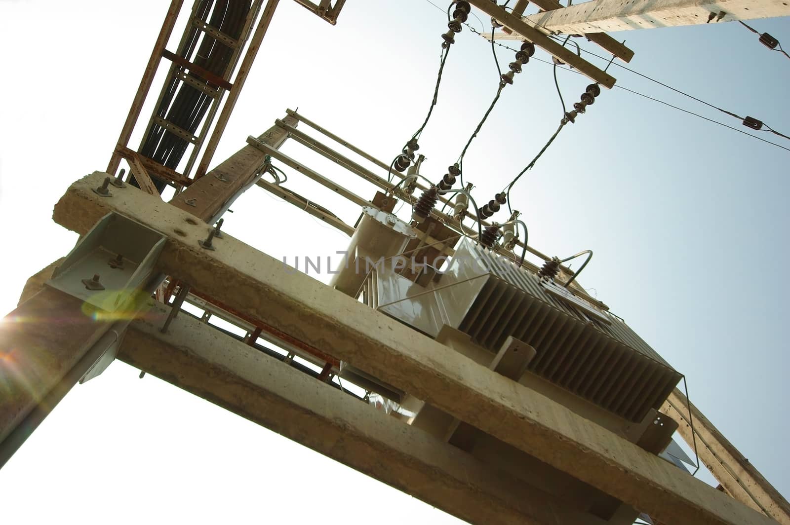 Electrical transformer on concrete pole by Satakorn