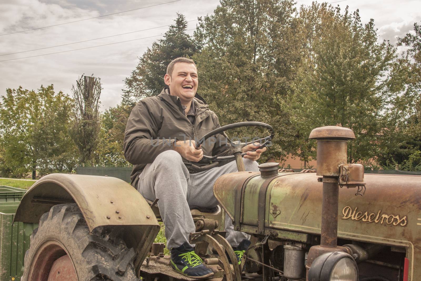 LENDINARA , ITALY 24 MARCH 2020: Happy Farmer at work