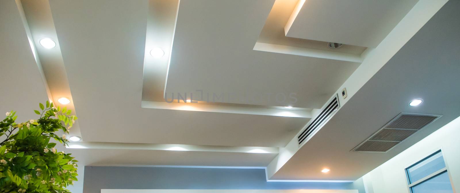 Lighting on the modern office ceiling by Satakorn