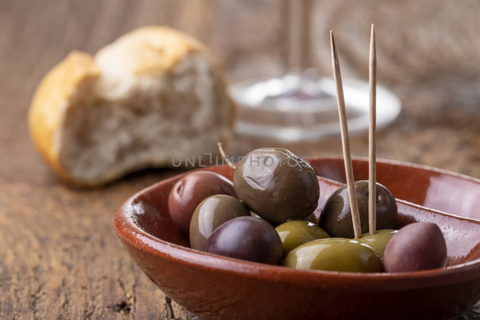 mixed olives on dark wood