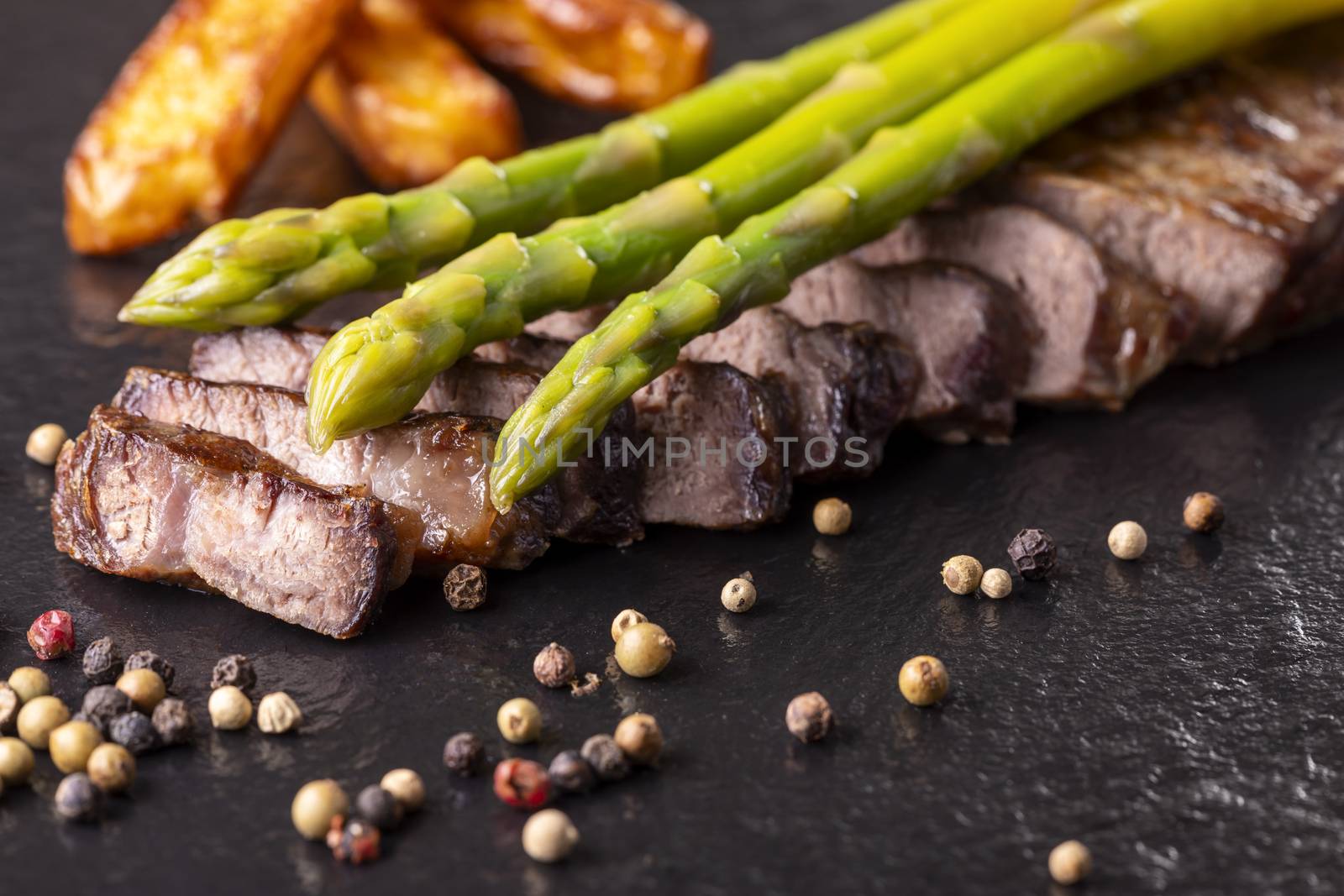 green asparagus on a steak