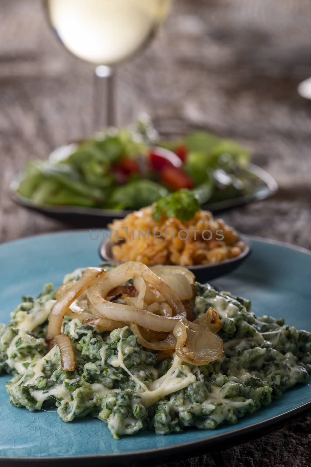 bavarian pasta with onions on a plate by bernjuer