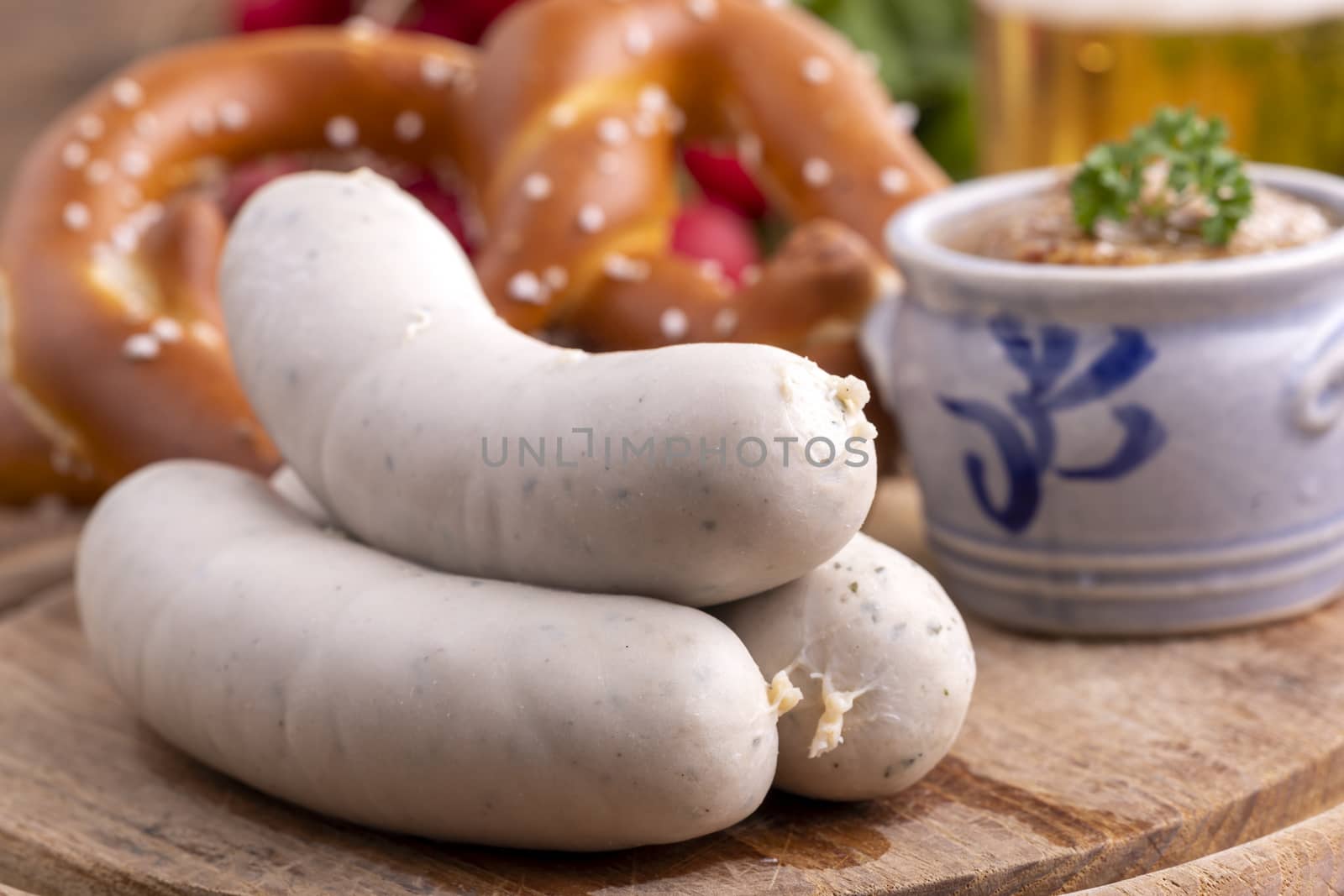 three bavarian white sausages with mustard