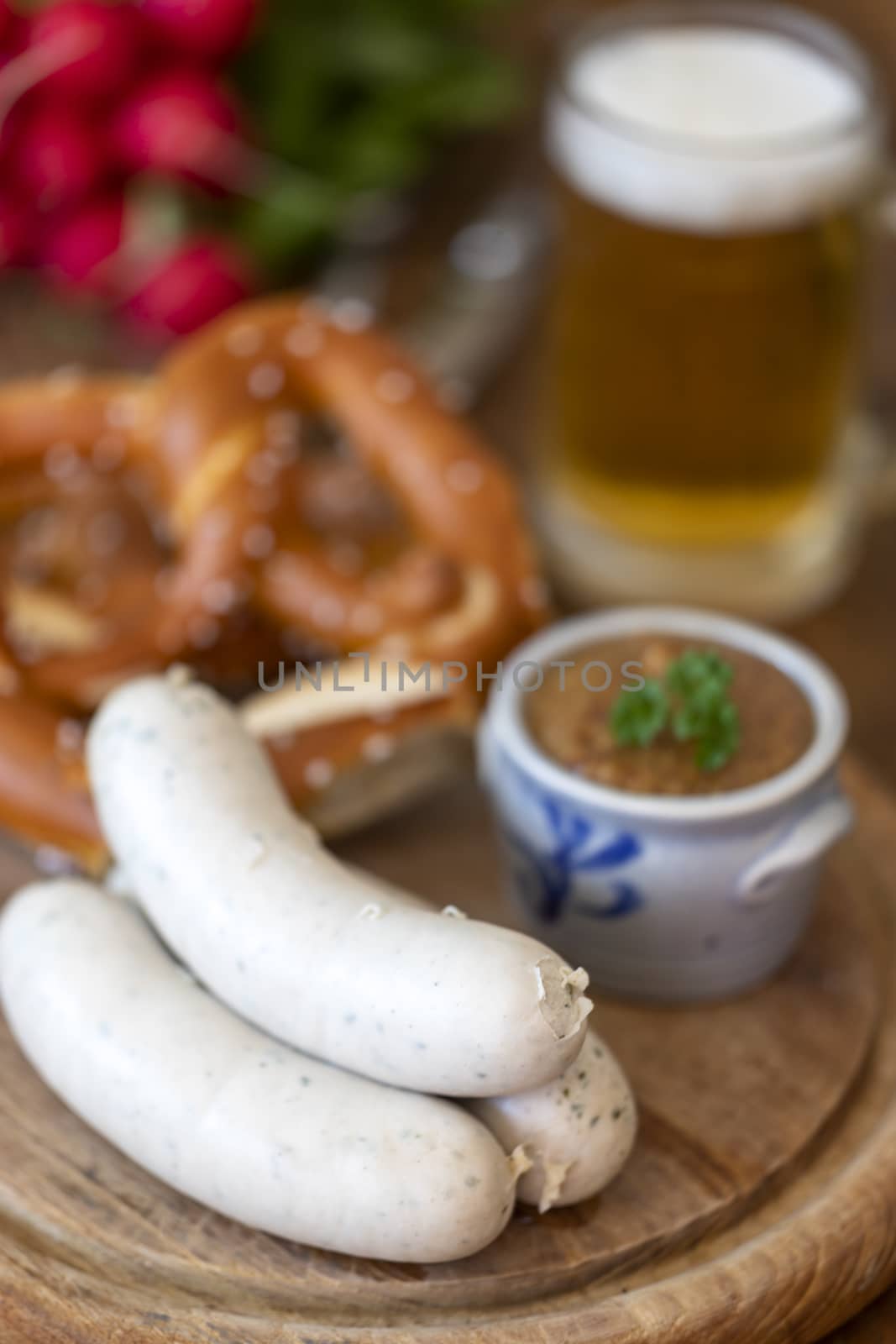 three bavarian white sausages with mustard