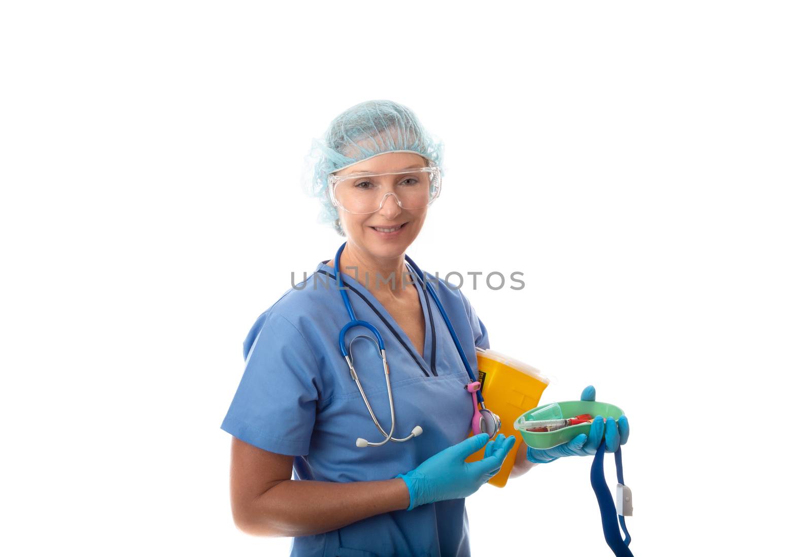 A nurse or pathologist holding blood tubes in a kidney dish, with tourniquet and sharps container