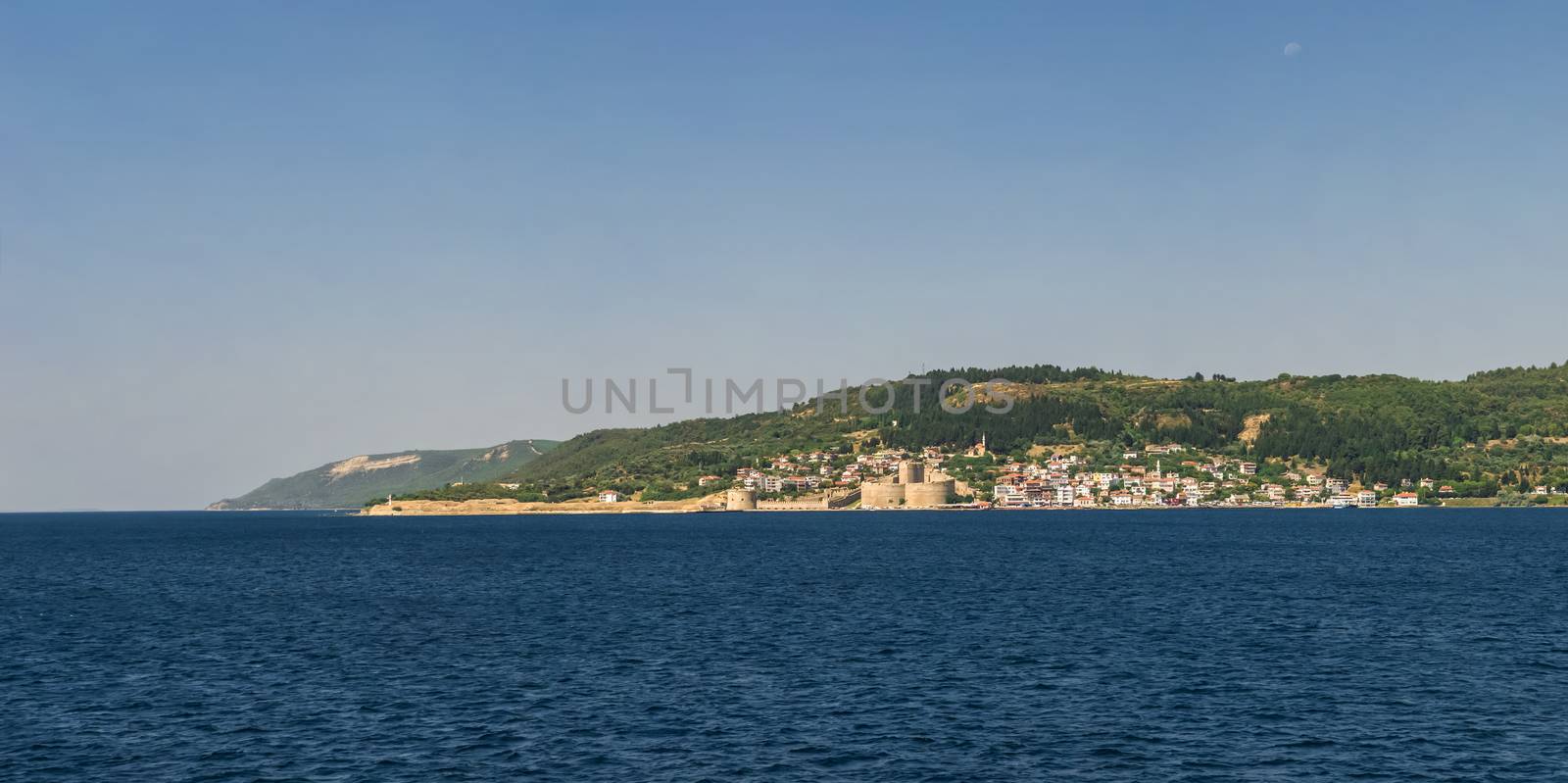 Canakkale, Turkey - 07.23.2019.  Kilitbahir castle and fortress on the west side of the Dardanelles opposite city of Canakkale in Turkey. Big size panoramic view on a sunny summer morning.