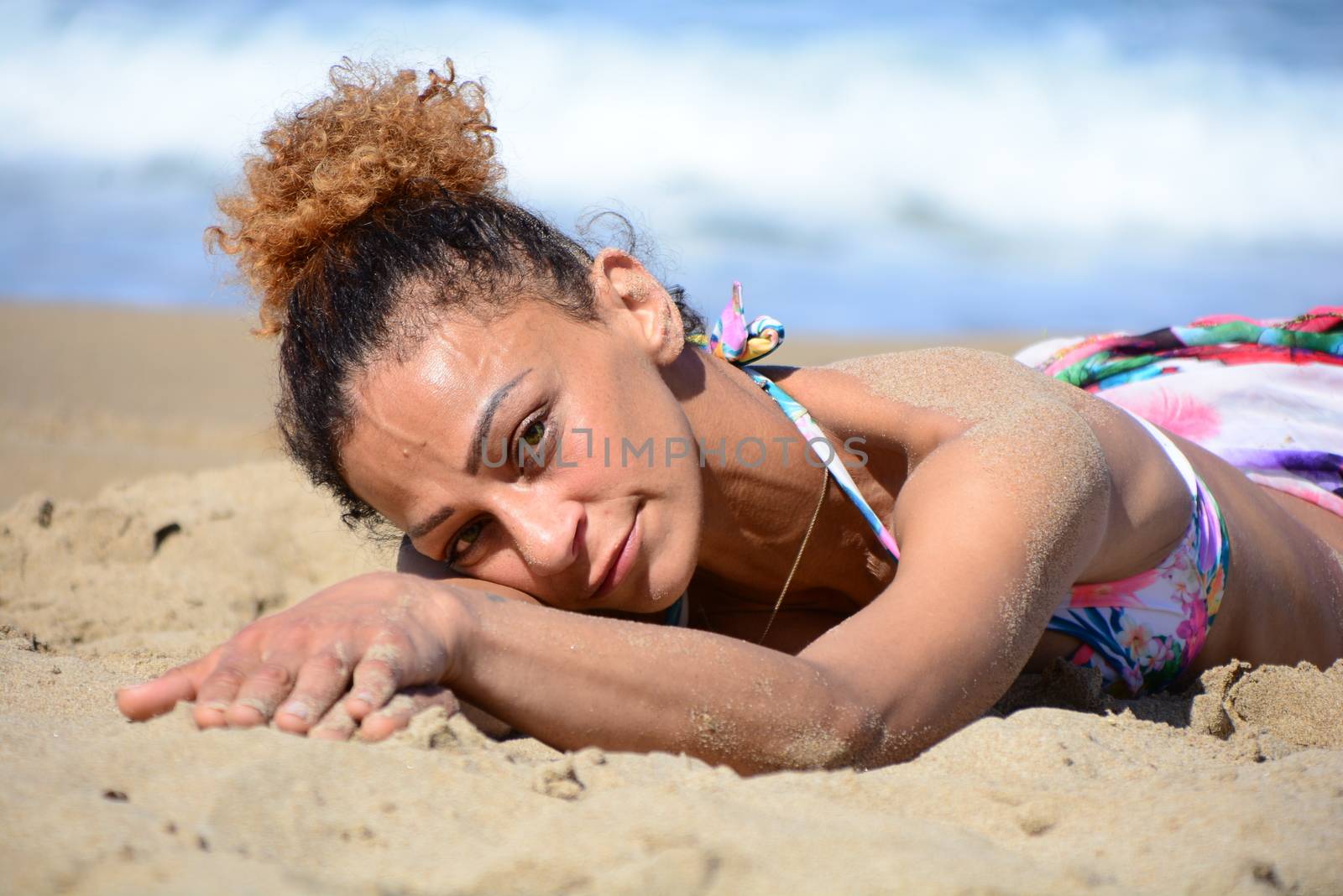 Photo shoot on the beach of a middle-aged woman in a sunny day