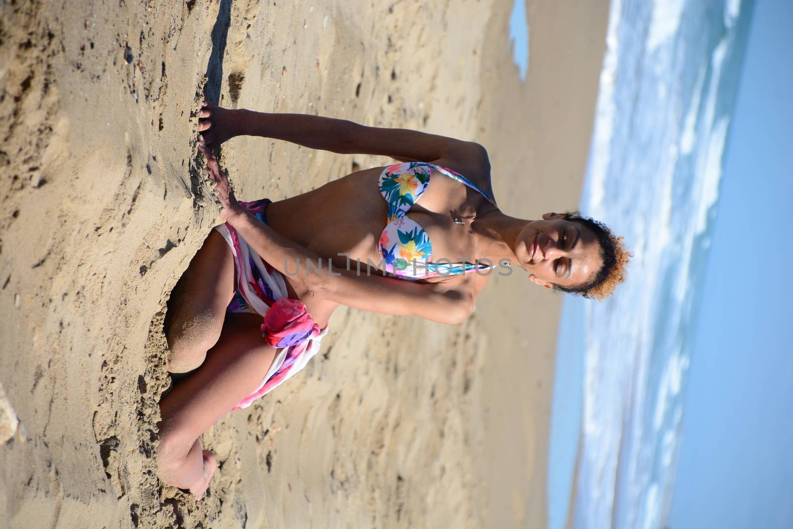 Photo shoot on the beach of a middle-aged woman in a sunny day