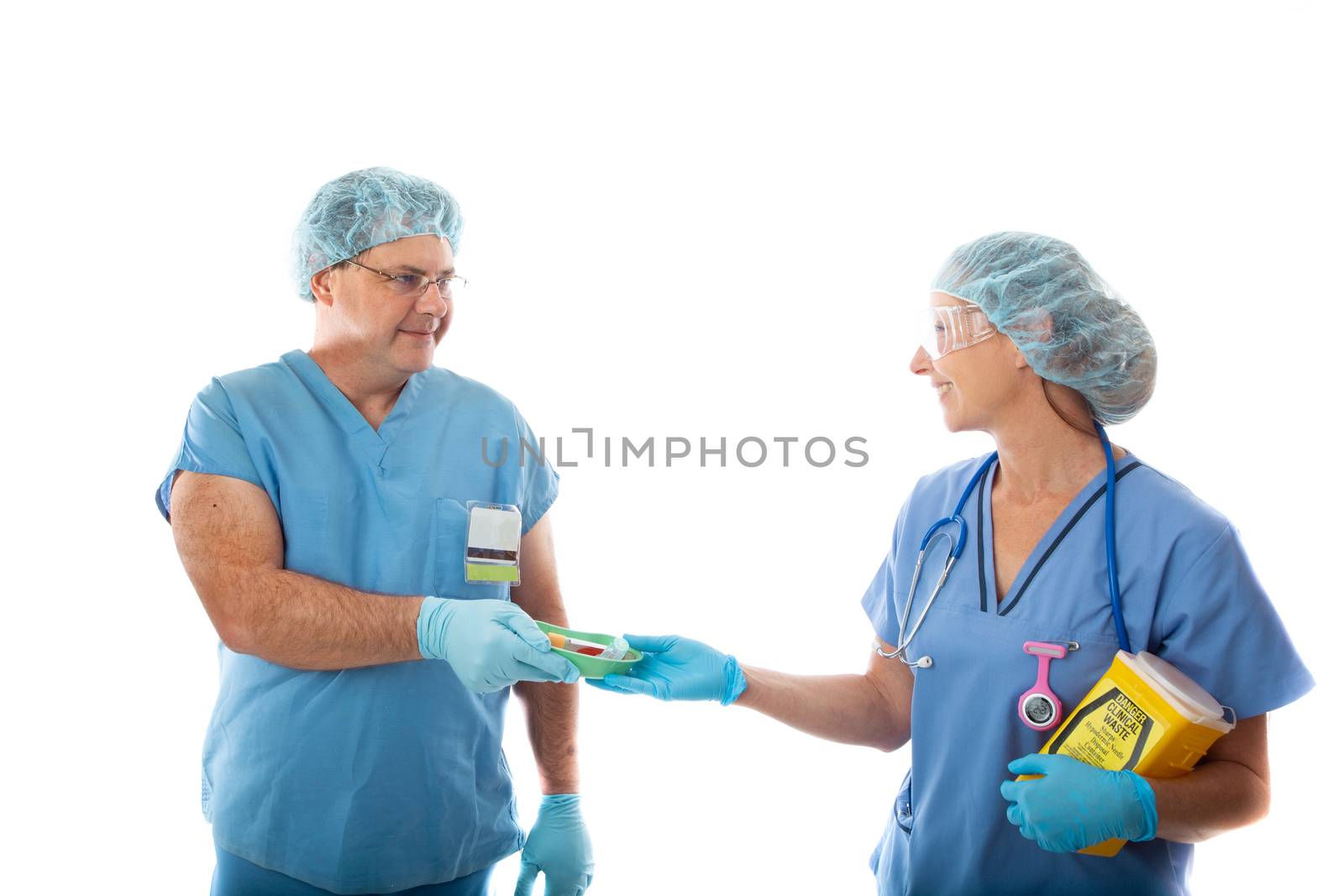 Two happy healthcare workers, nurses at work together in hospital or clinic, teamwork