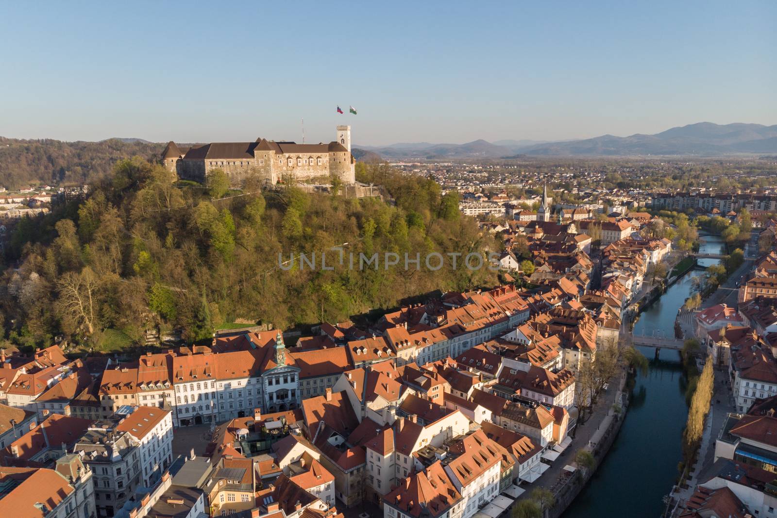 Aerial drone panoramic view of Ljubljana, capital of Slovenia in warm afternoon sun.