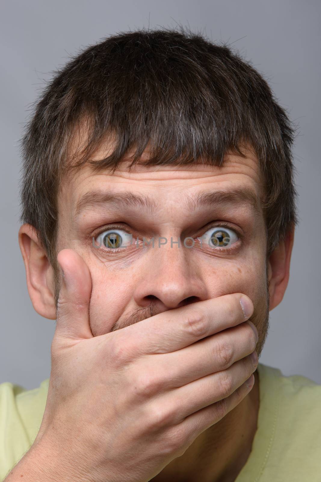 Close-up portrait of a man of European appearance, depicting a fright