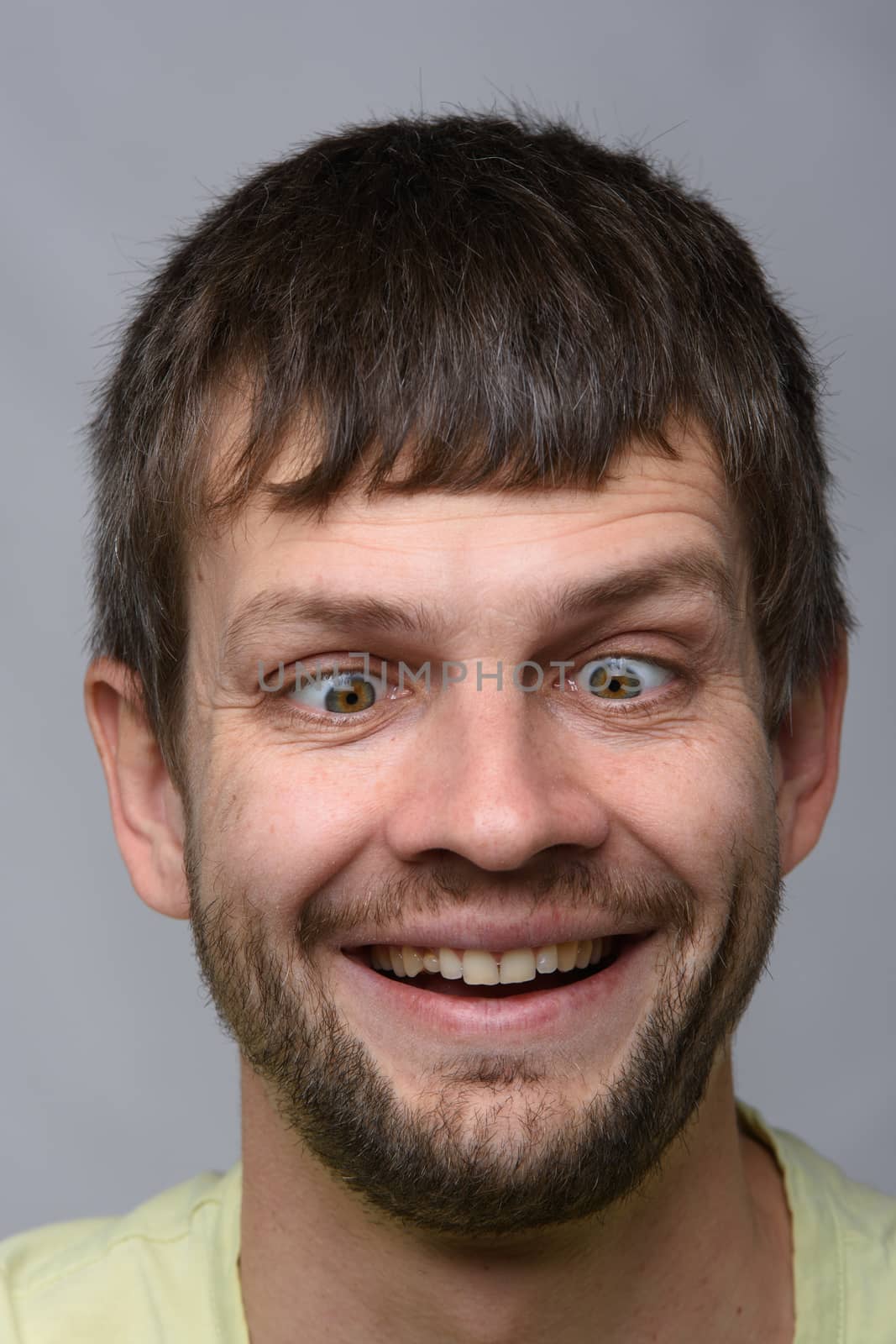 Closeup portrait of a crazy man of European appearance