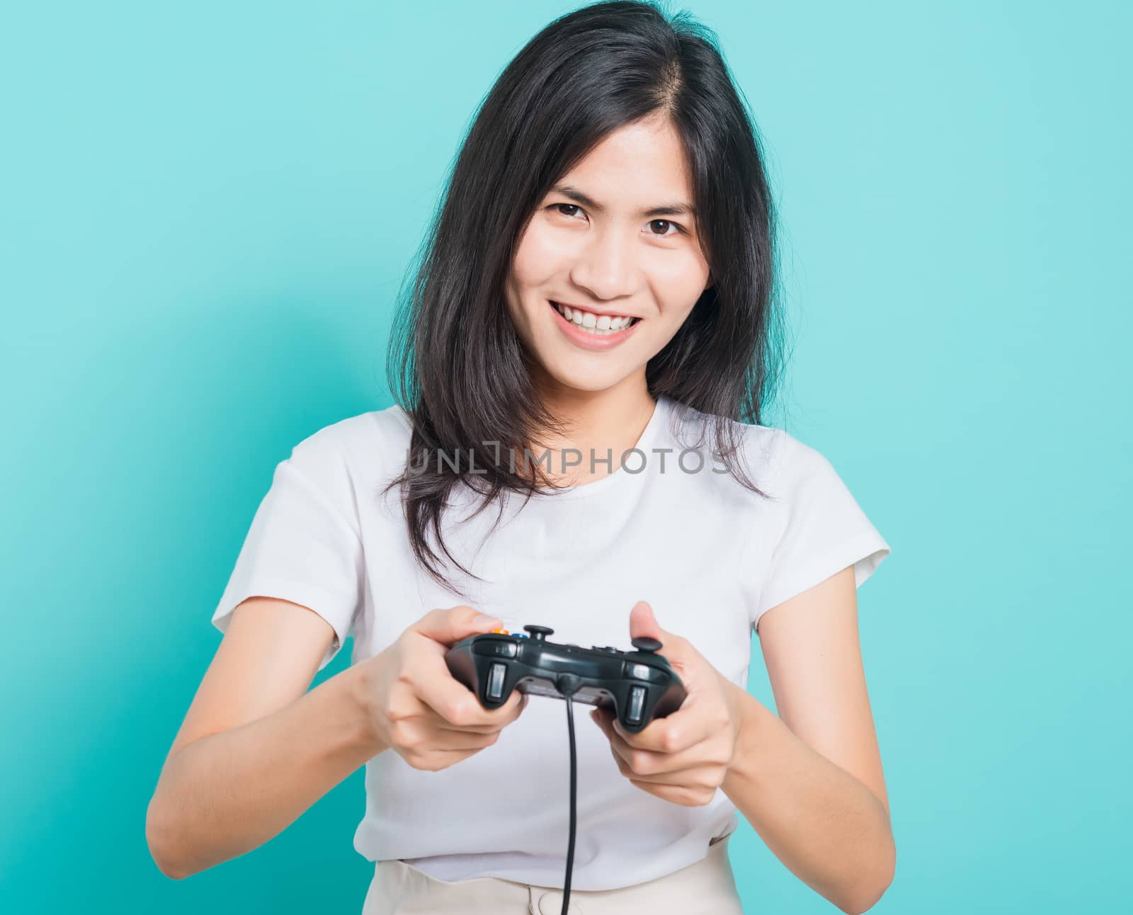 woman wear t-shirt gamer with a joystick by Sorapop