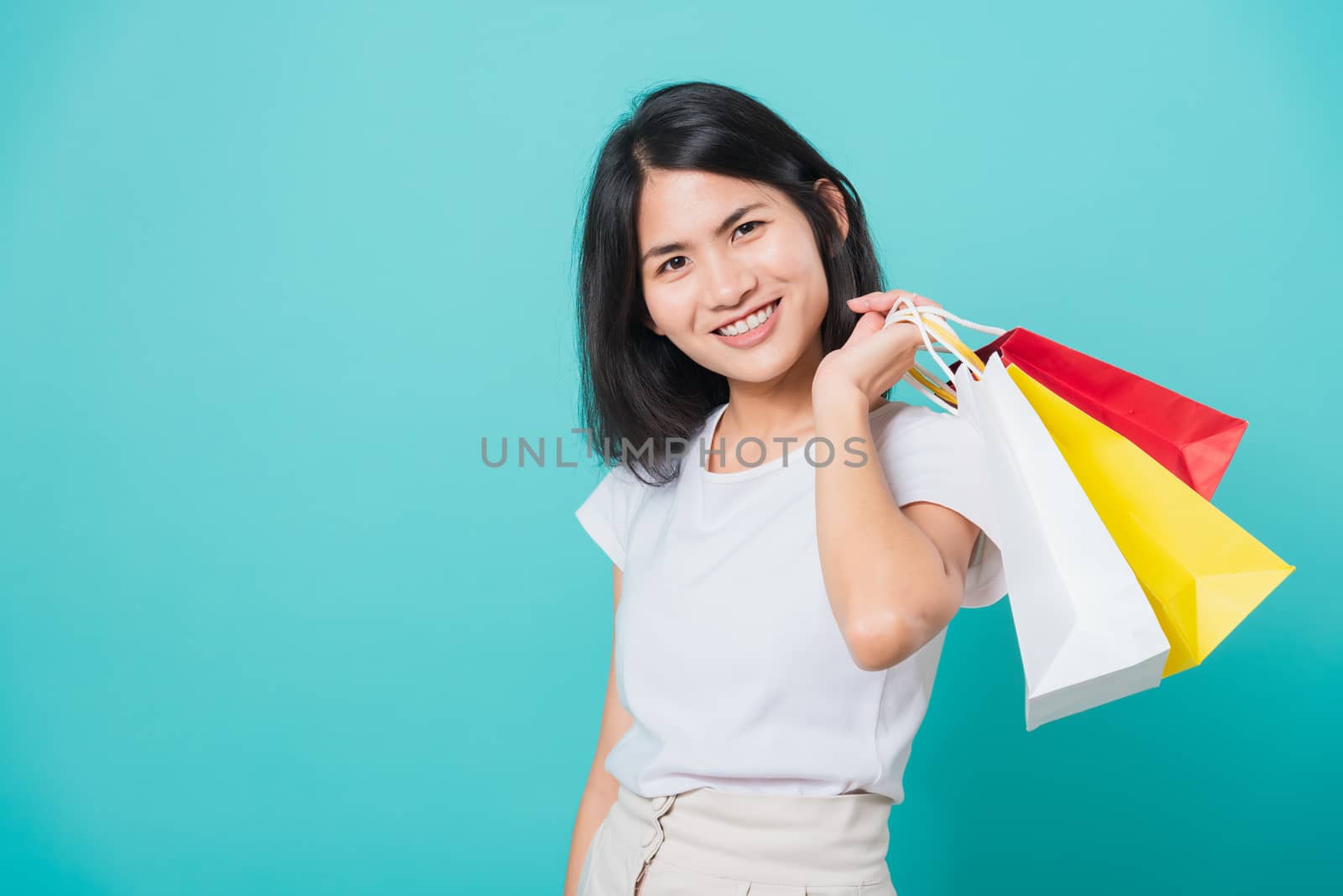 woman standing wear white t-shirt, holding shopping bags multi c by Sorapop