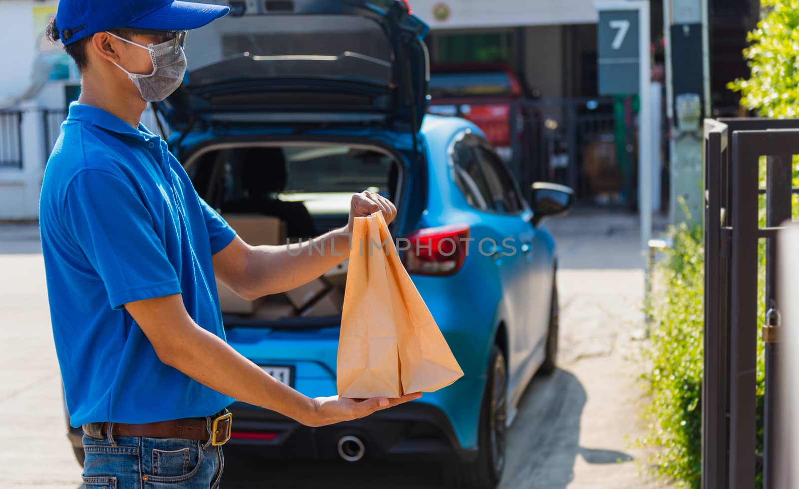 delivery man courier online with food order takeaway paper bag c by Sorapop