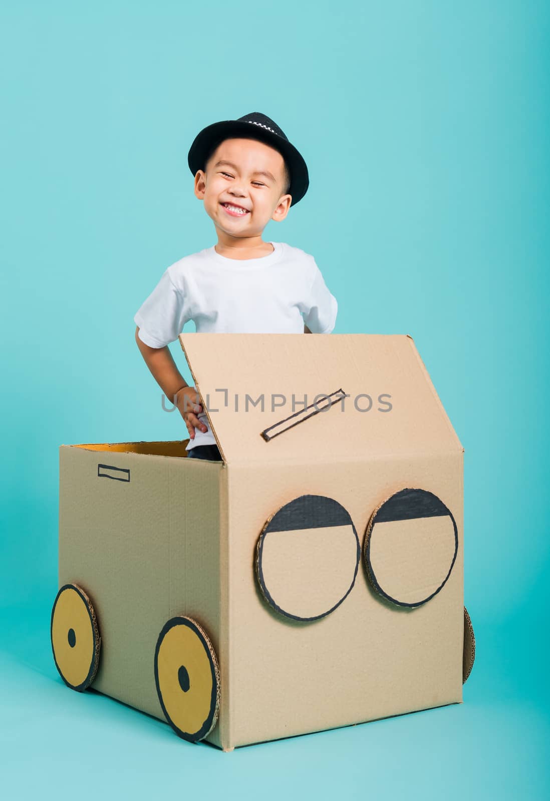 Baby children boy smile in driving play car creative by a cardbo by Sorapop