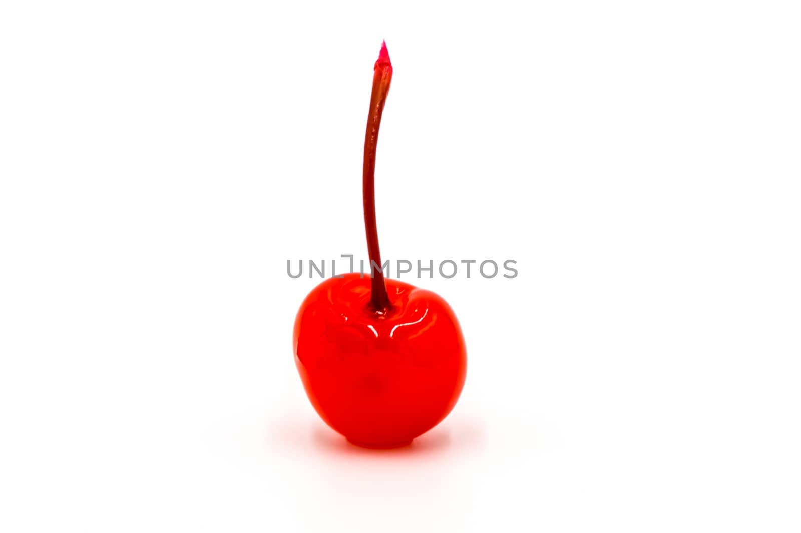 Candied cherries very red with its stem on a white background