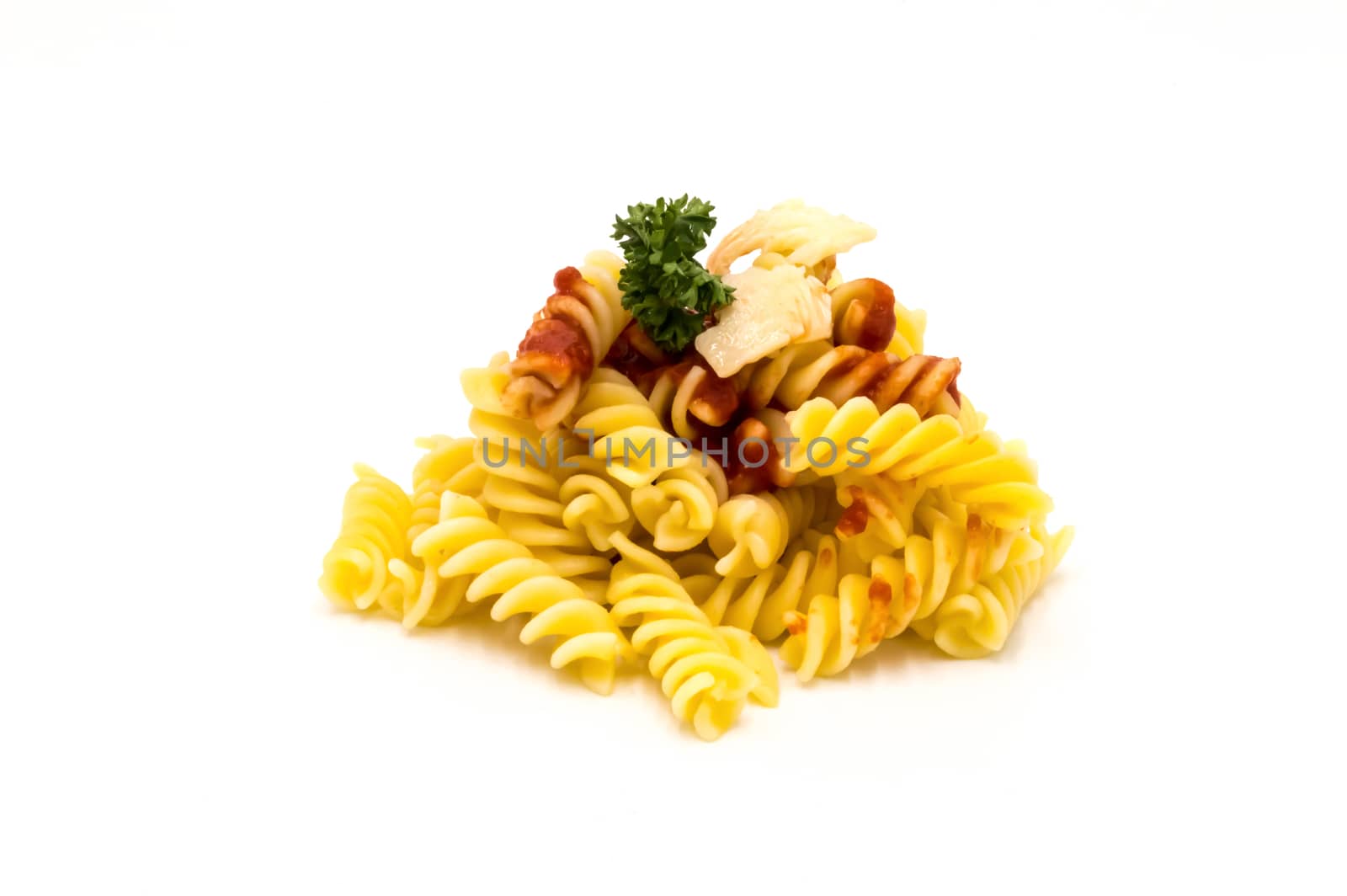 Twisted pasta with a tomato coulis and gruyere cheese on a white background
