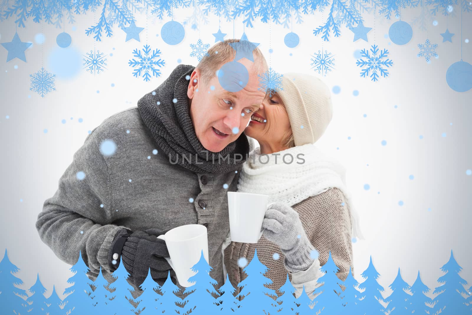 Happy mature couple in winter clothes holding mugs by Wavebreakmedia