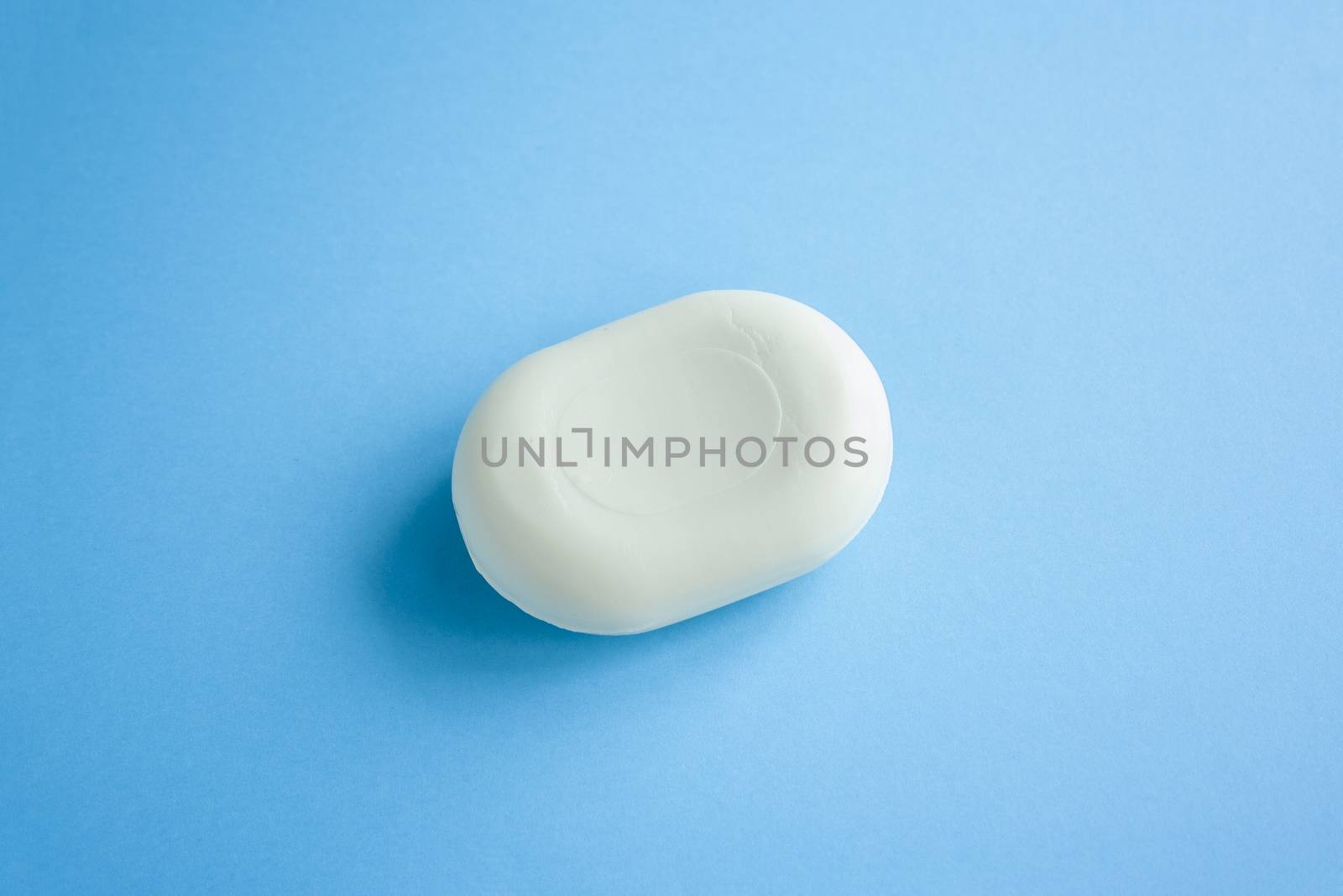 Soap top view on a blue background with trendy  by Quils