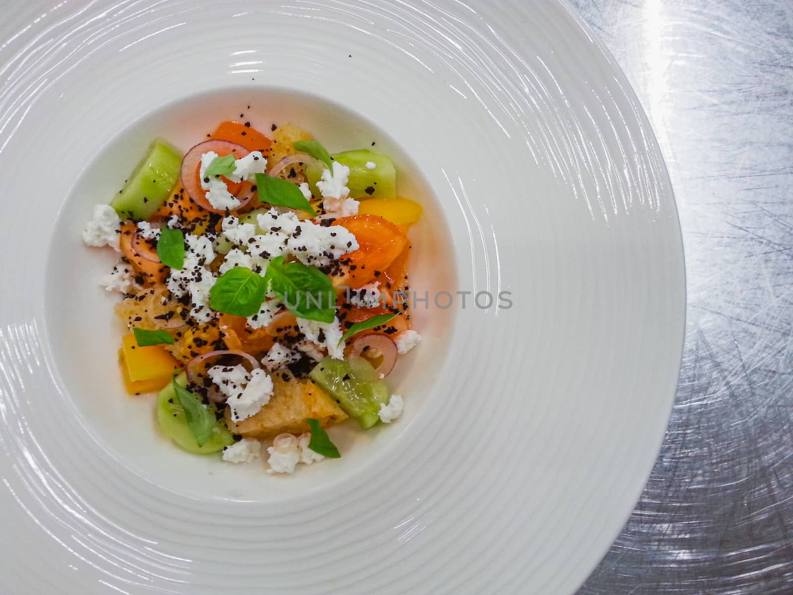 Colorful fruity salad with kiwi oranges basil and cottage cheese