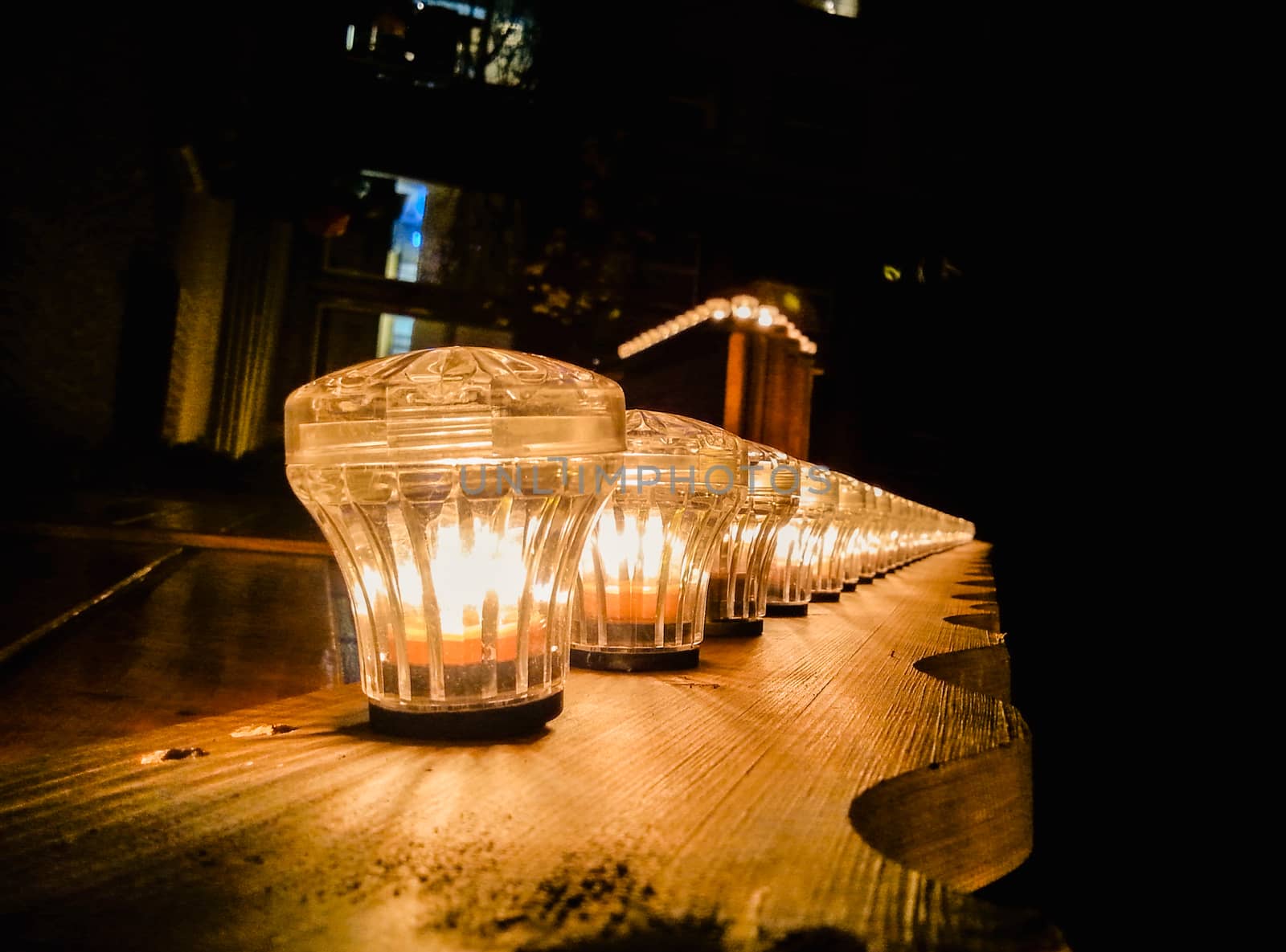 Wooden board with screwed decorative lamps inside  