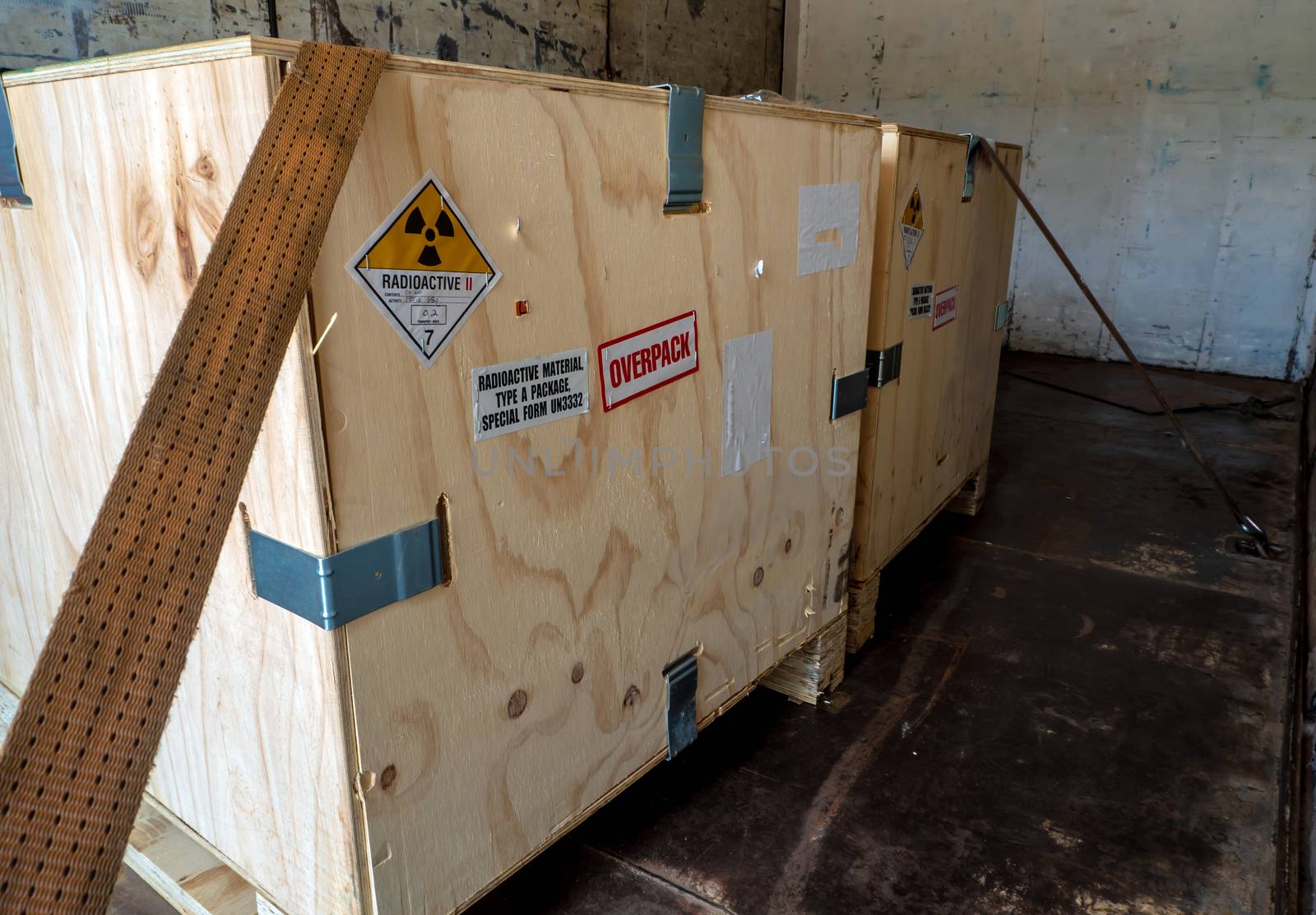 Radioactive material label beside the transportation wooden box Type A standard package in the truck