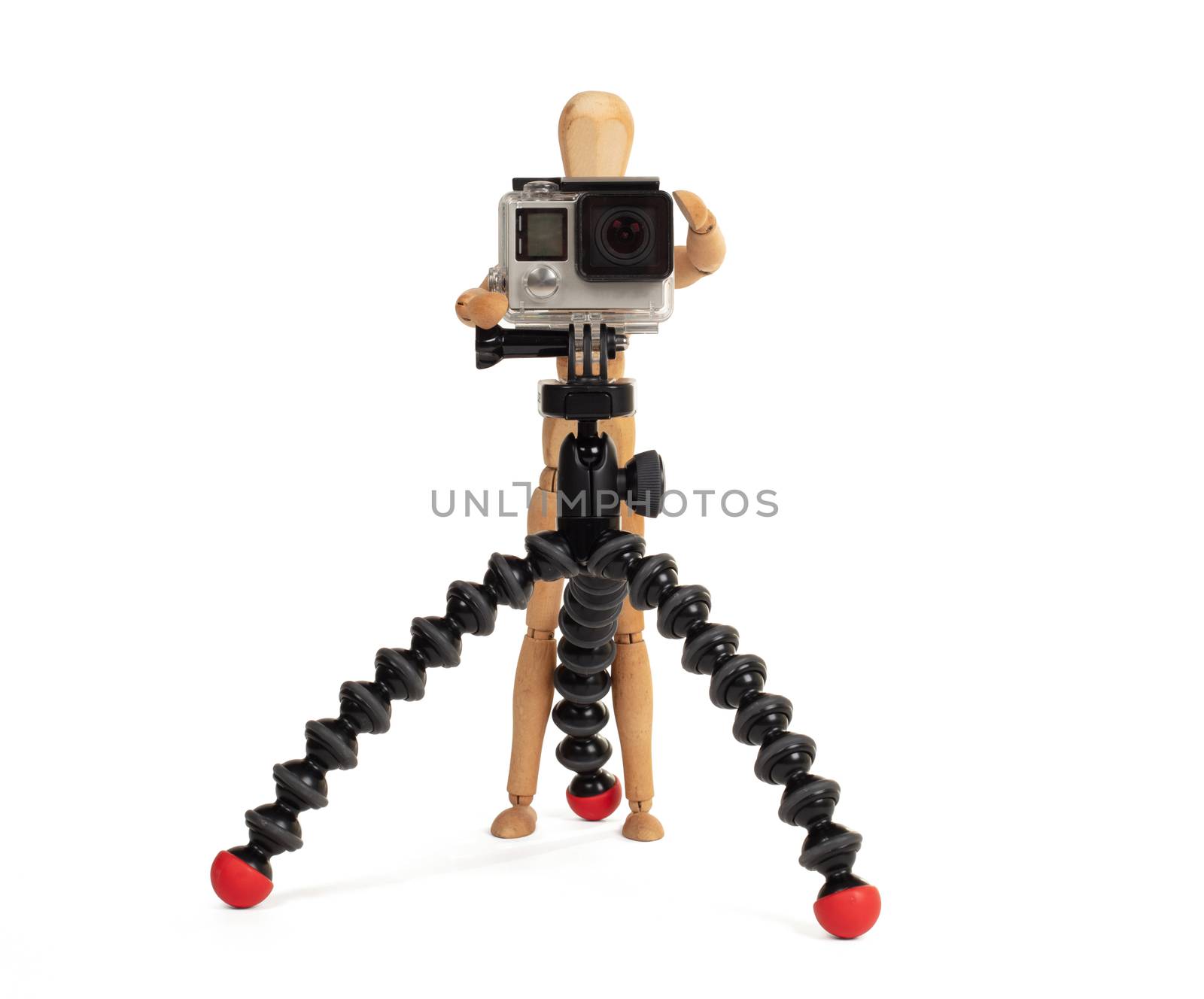 Wooden dummy standing trying to make a video or photo, isolated on white