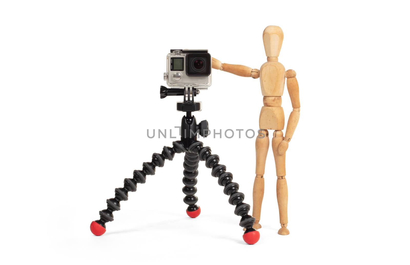 Wooden dummy standing trying to make a video or photo by michaklootwijk