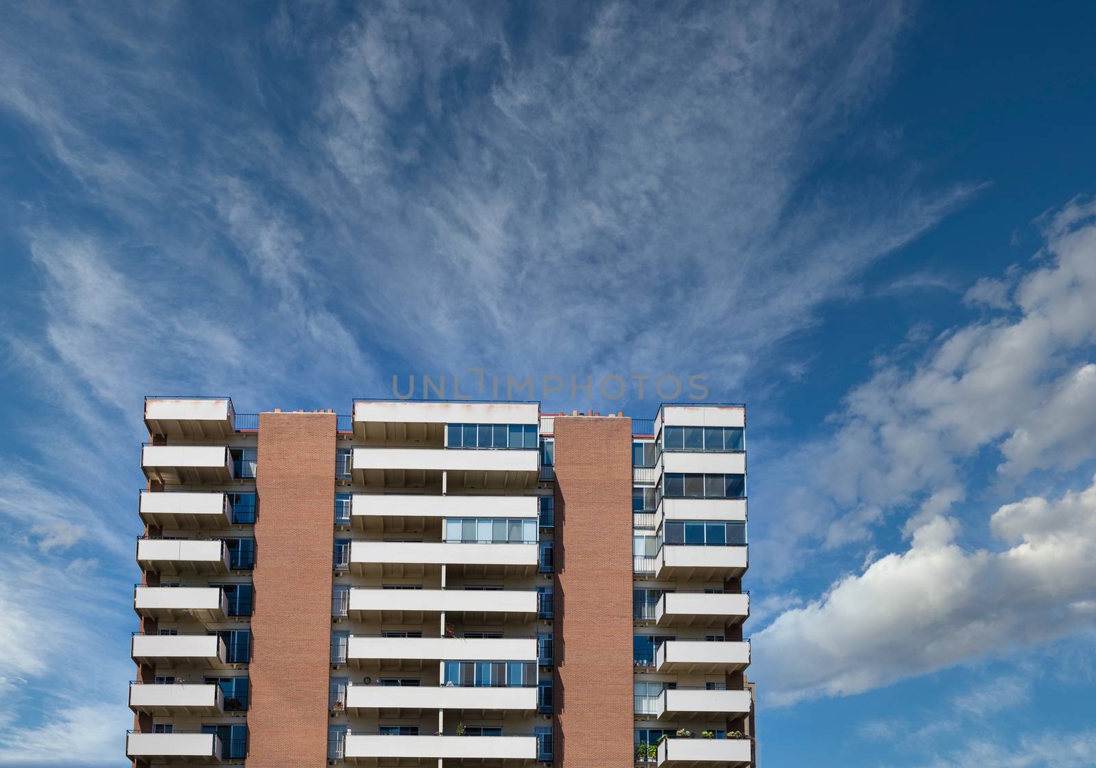 Balconies on Condos Under Nice Blue Sky by dbvirago