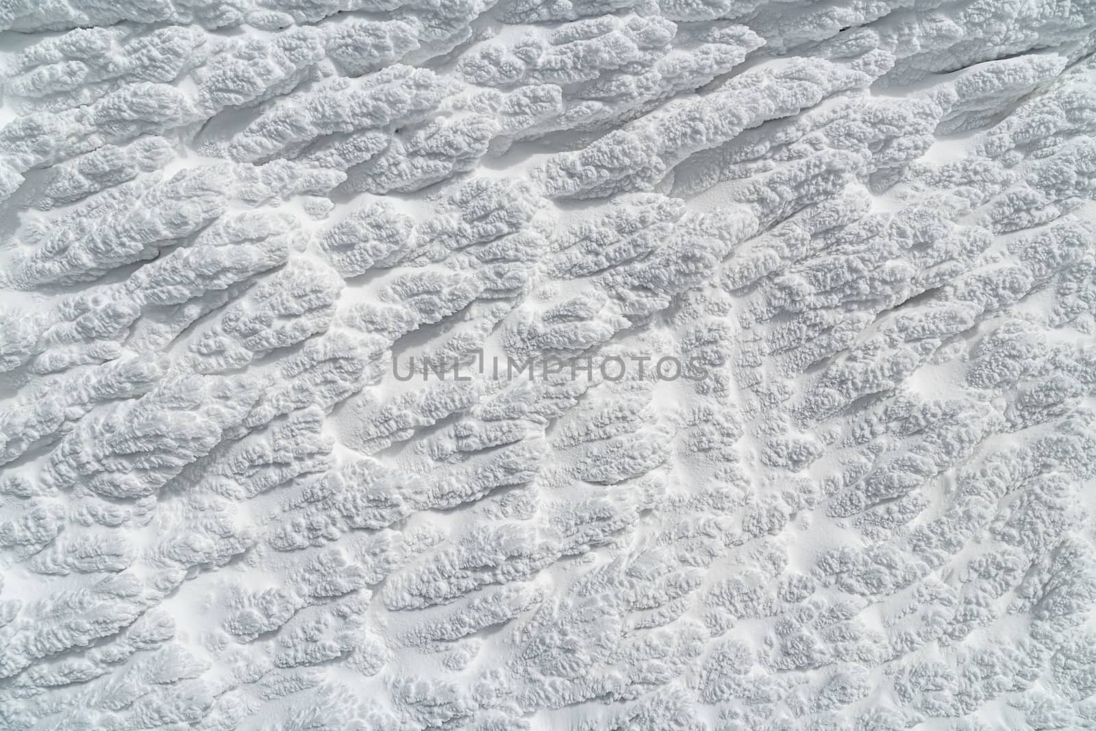 Icy texture of snow after a blizzard on a windy morning. by petrsvoboda91