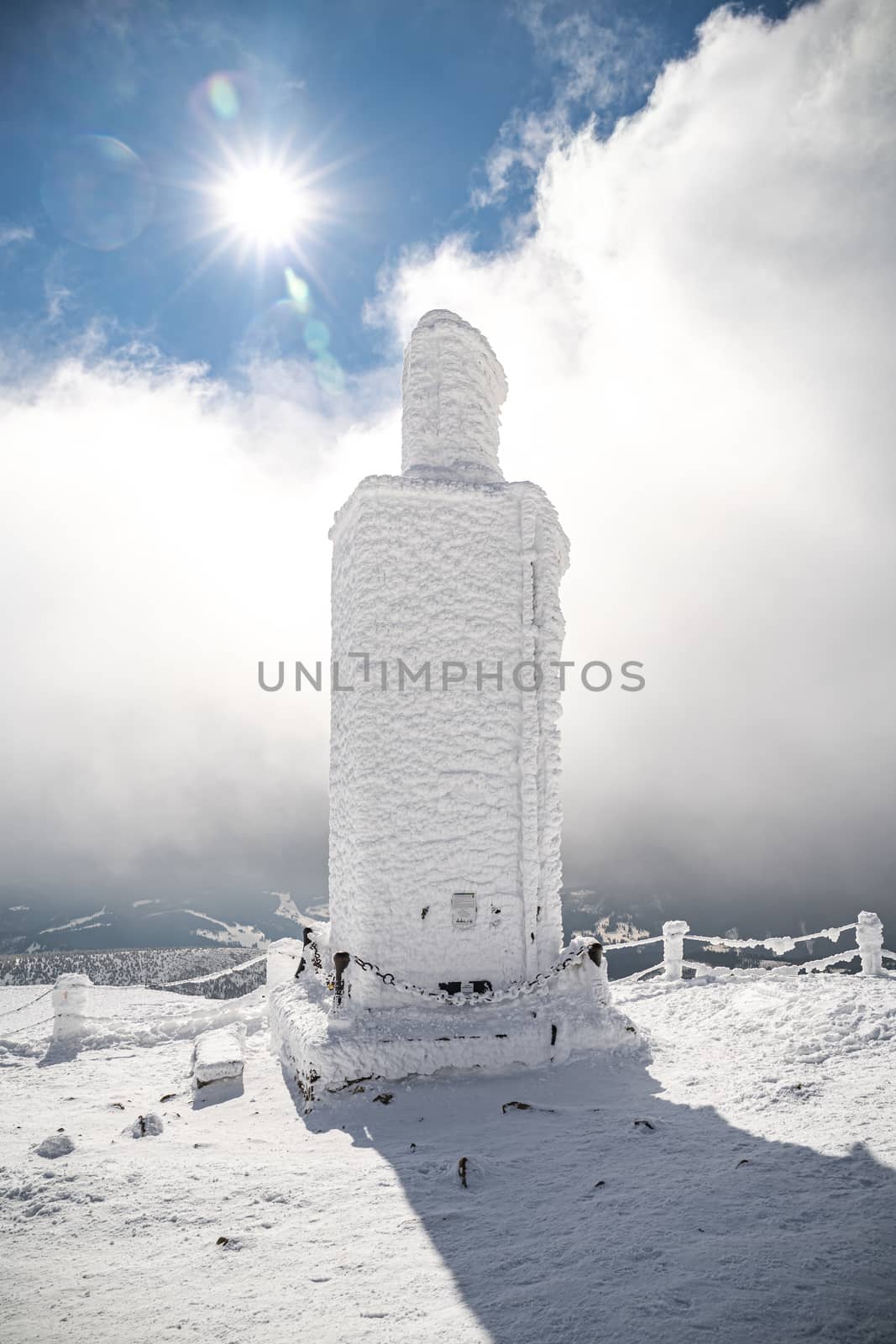 A frosty mound on a summit of Snezka mountain, located on borders with Poland. Winter picture of Czech national park called Krkonose.