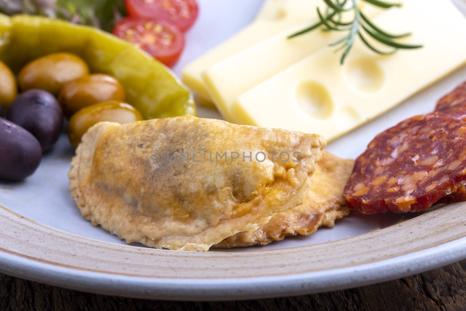 empanadas and spanish tapas on a plate