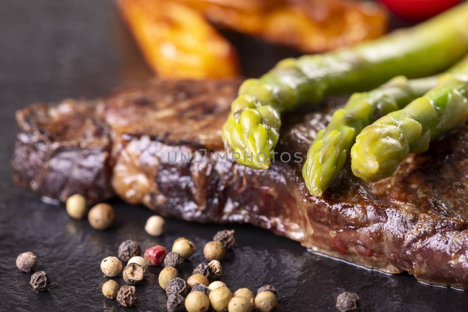 green asparagus on a steak