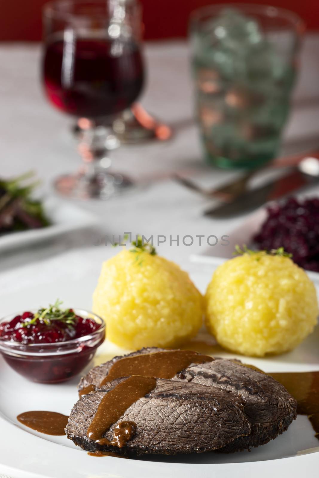 closeup of a german sauerbraten with dumplings