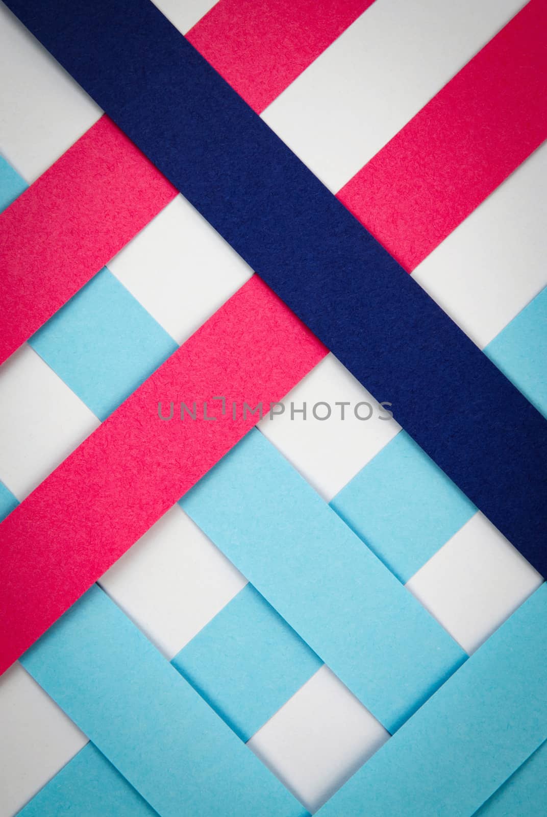 abstract background strips of colored paper cross each other