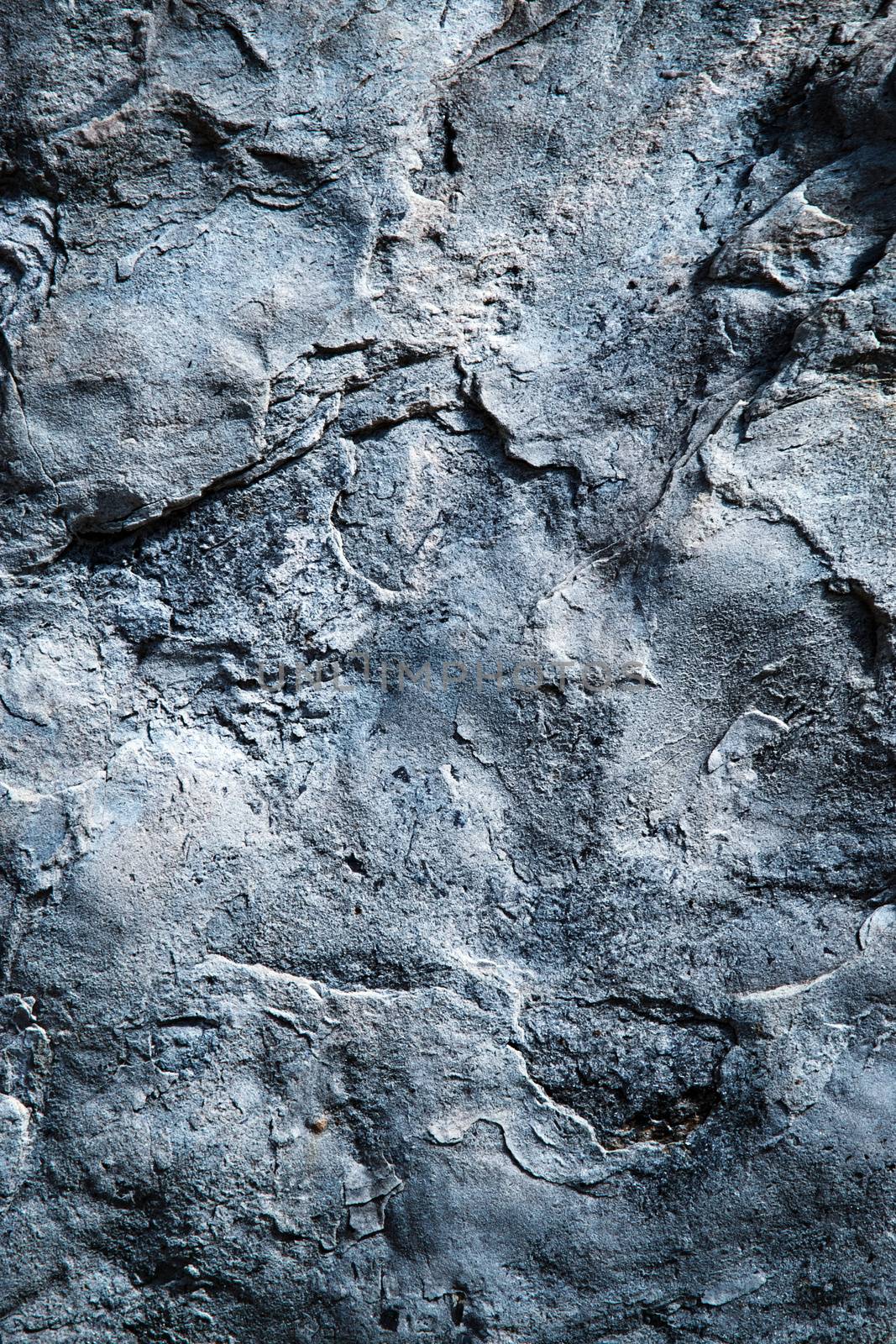 background or texture rugged surface of dark gray blue sandstone