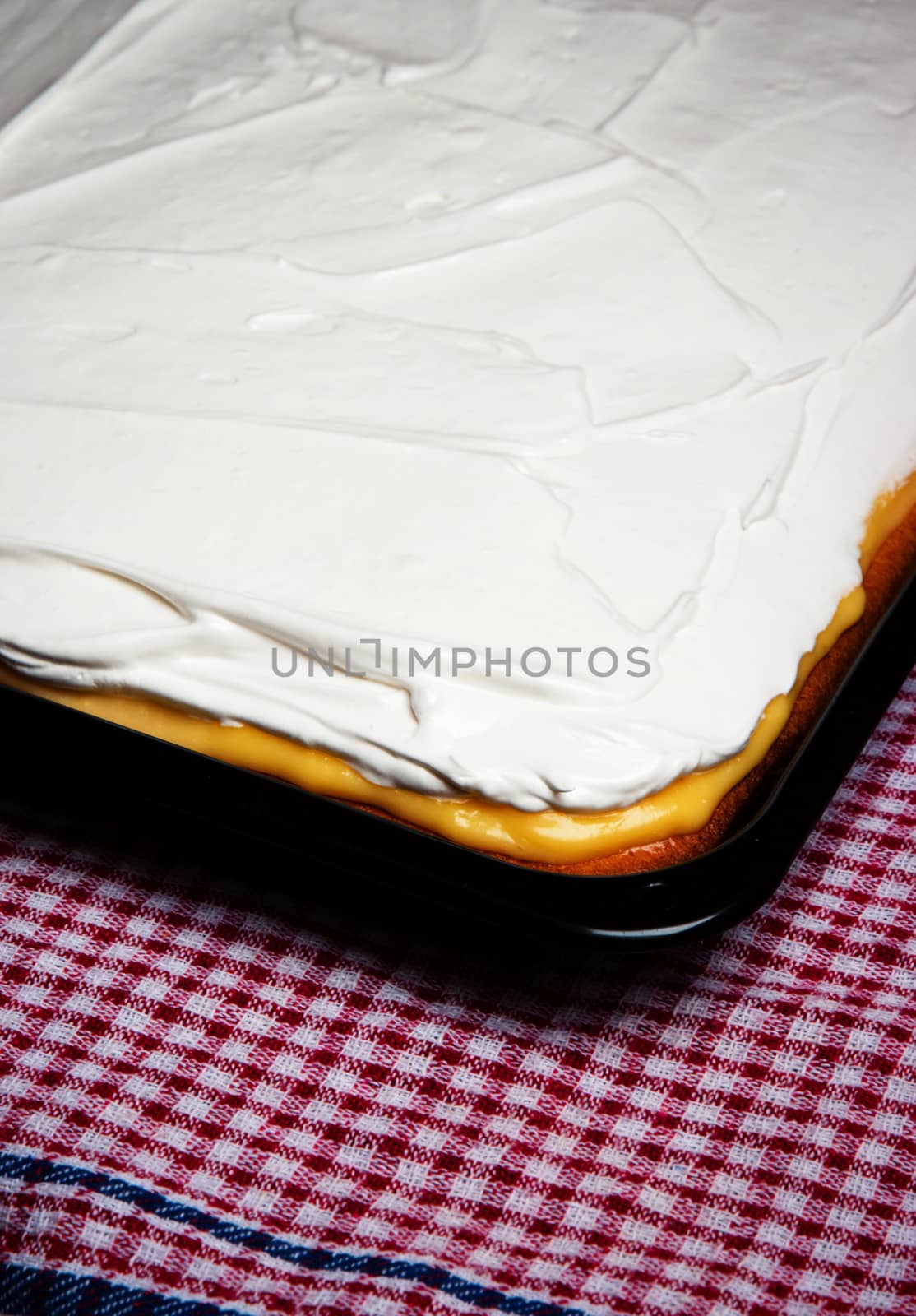 food background cream cake on baking pan