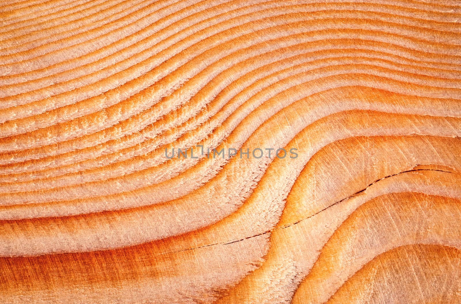 abstract background lines and waves on a wooden faceted board