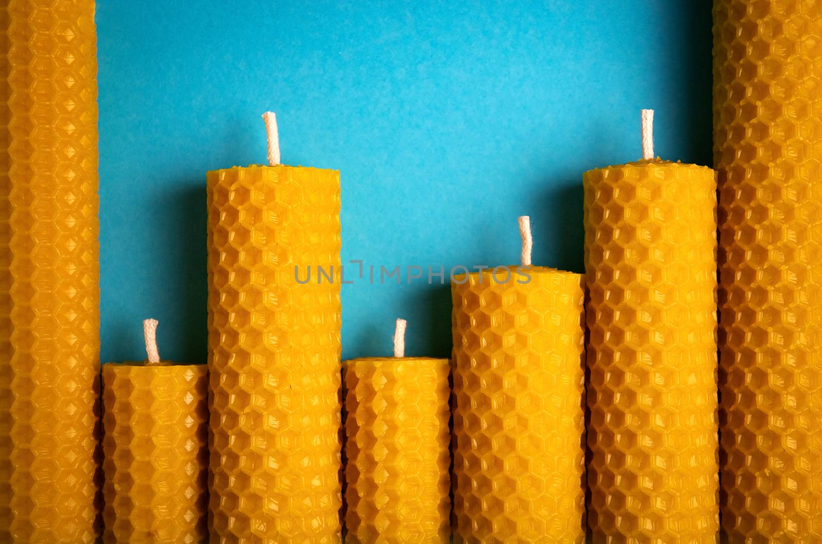 blue paper background candles with wax honeycomb