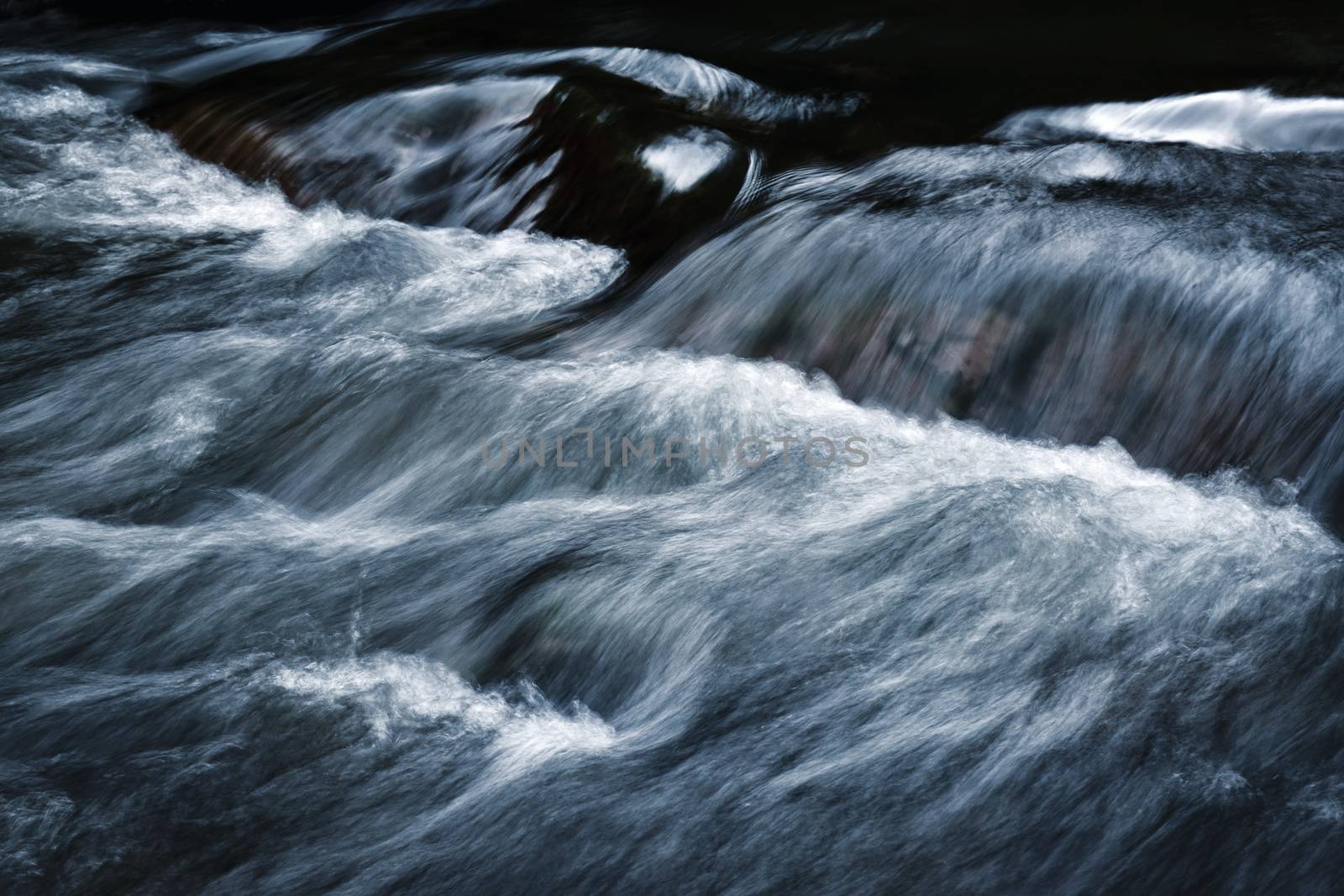 Dark blue wild river rapids by Ahojdoma