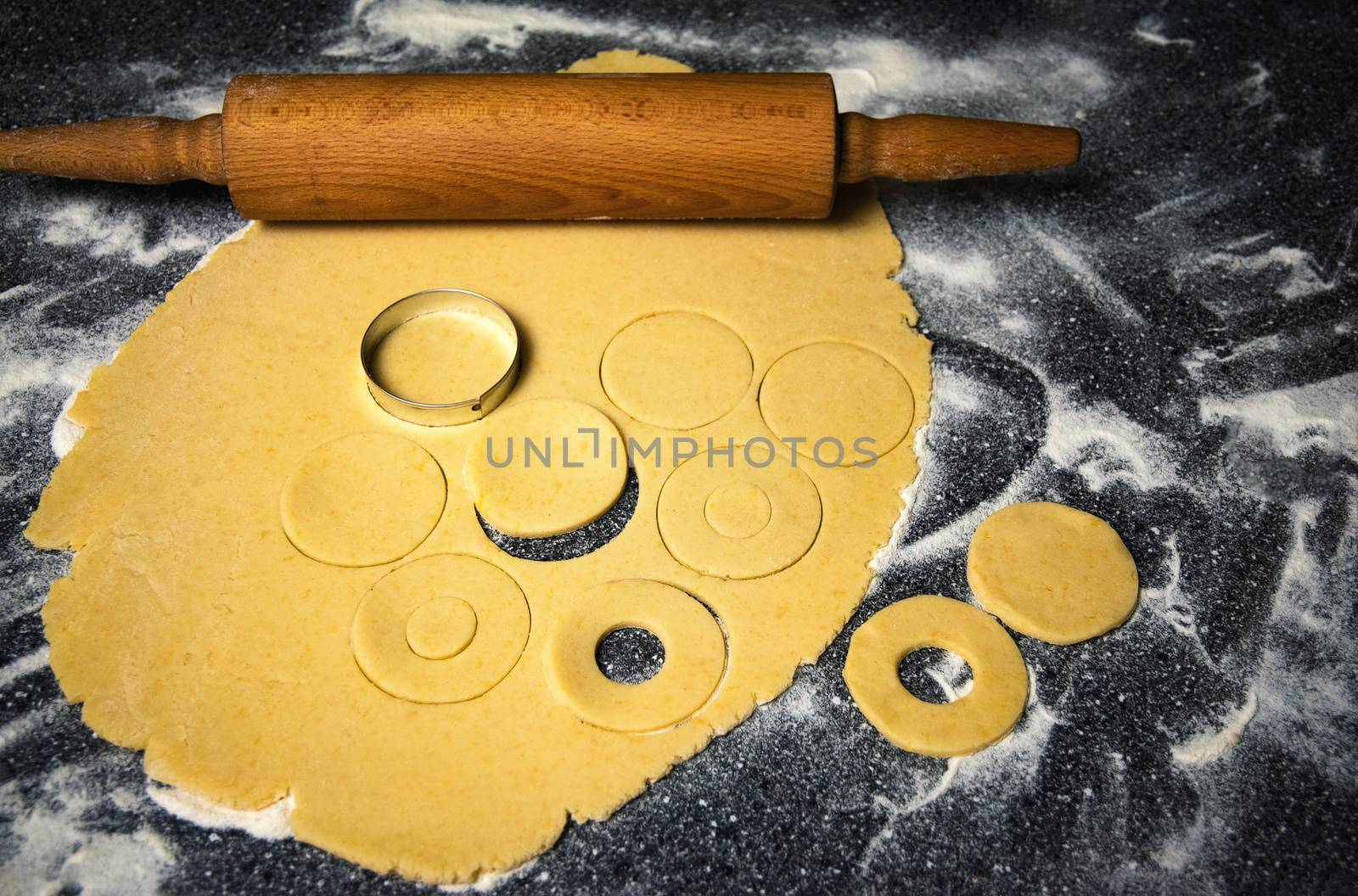 food background wood roller and dough prepared for cakes