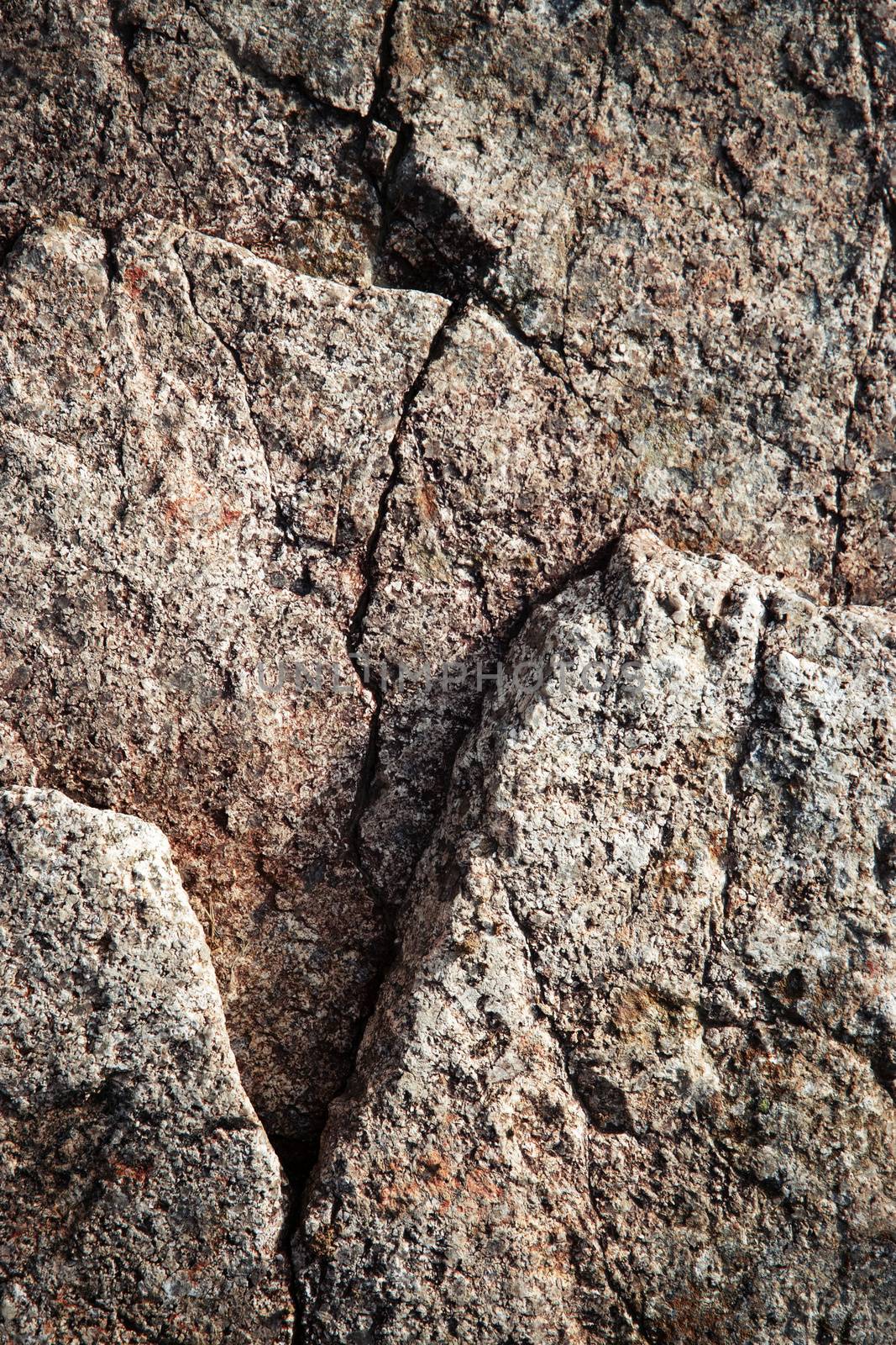a brown granite block with a crack by Ahojdoma