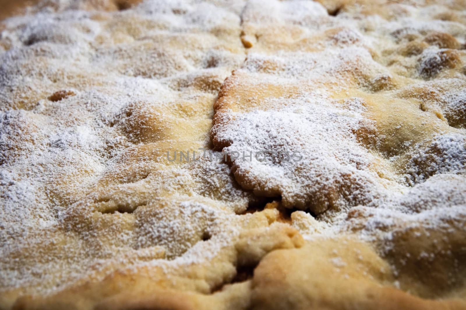 food background the surface of cake sprinkled with sugar