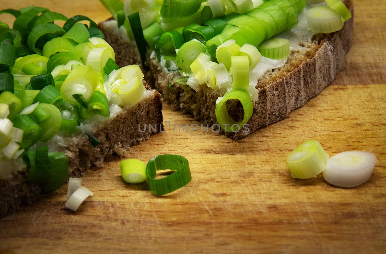 food background bread with ointment and chopped onion