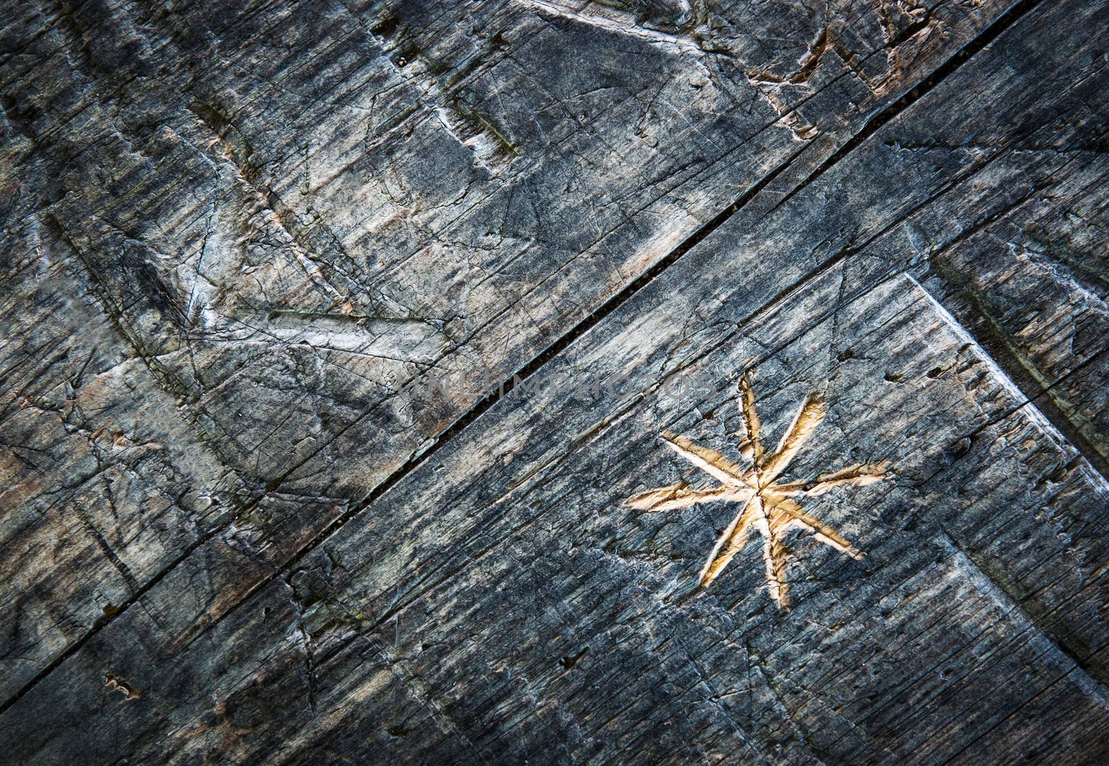 background or texture a star carved in old wood