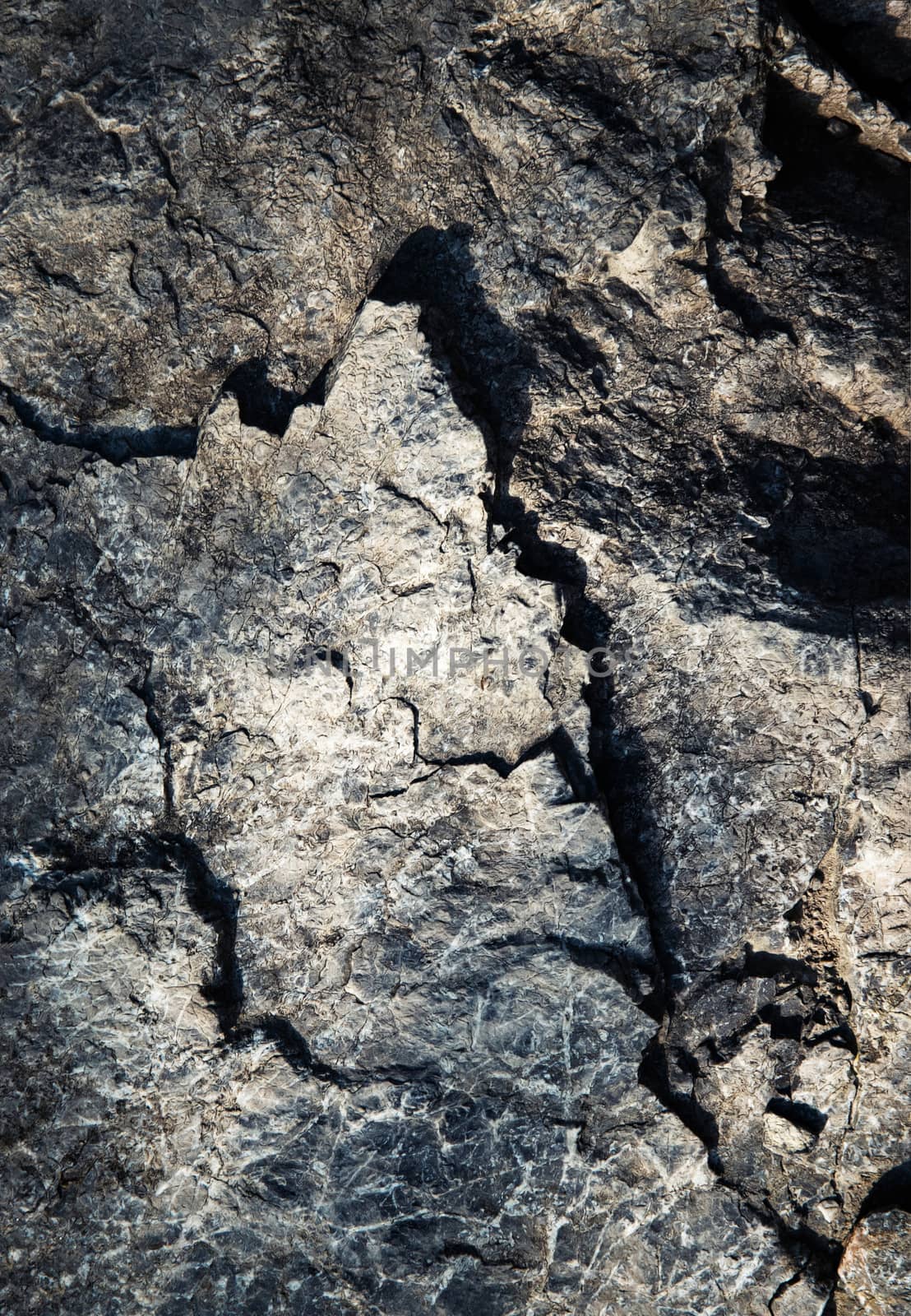 detail of a dark gray-blue rock by Ahojdoma