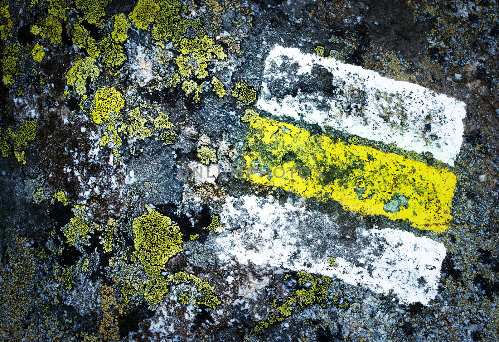 detail yellow tourist sign on granite by Ahojdoma