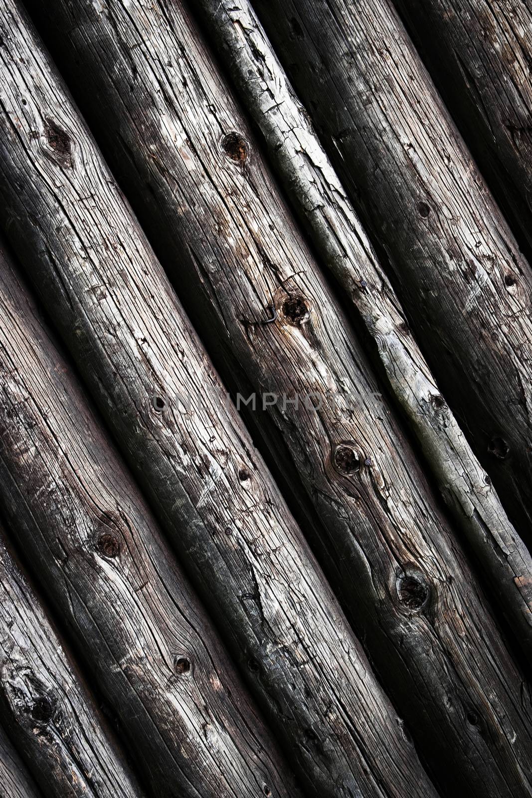 background or texture obliquely laid old round beams